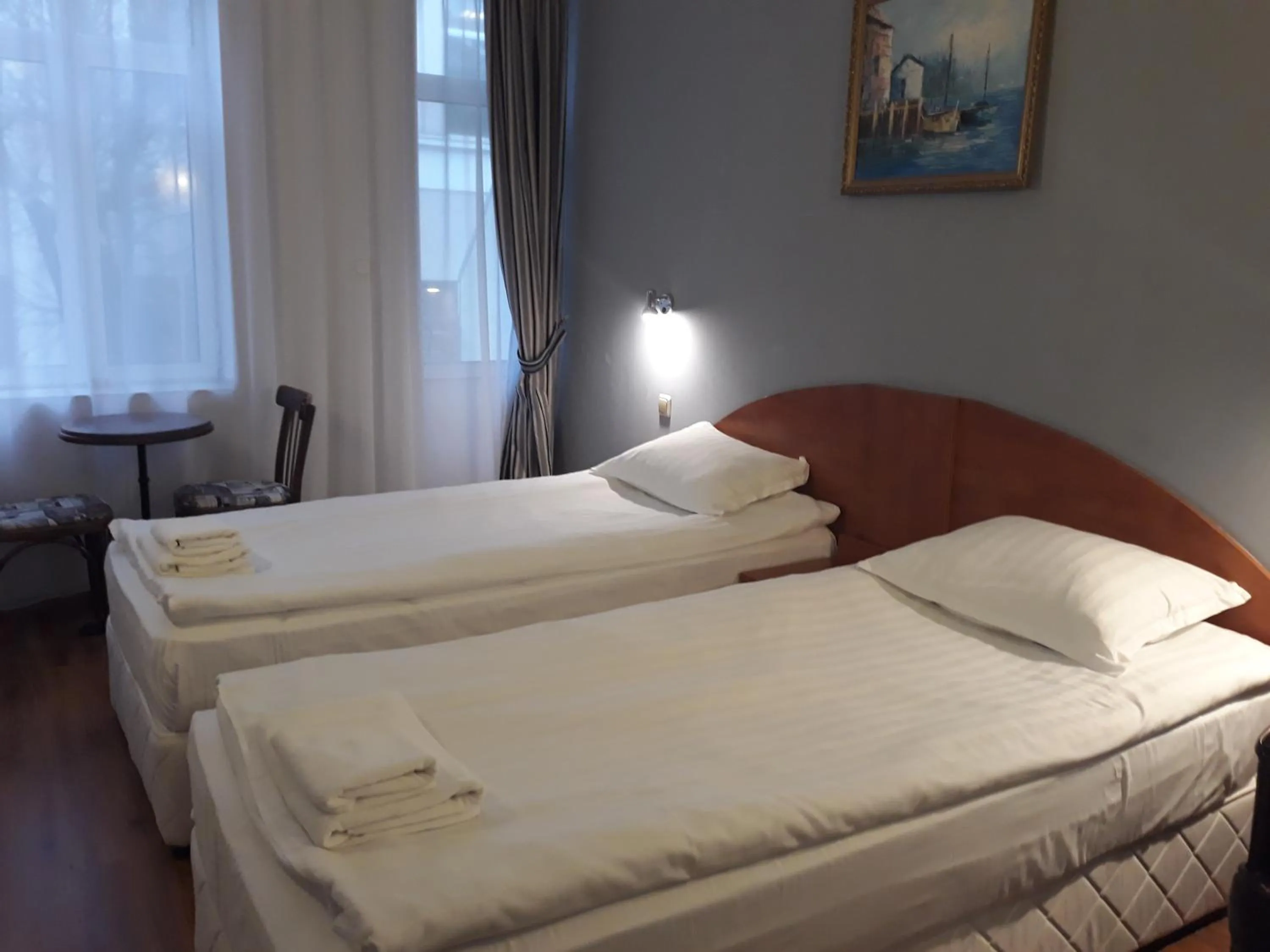 Bed in Three Dolphins Hotel with a Rooftop terracе