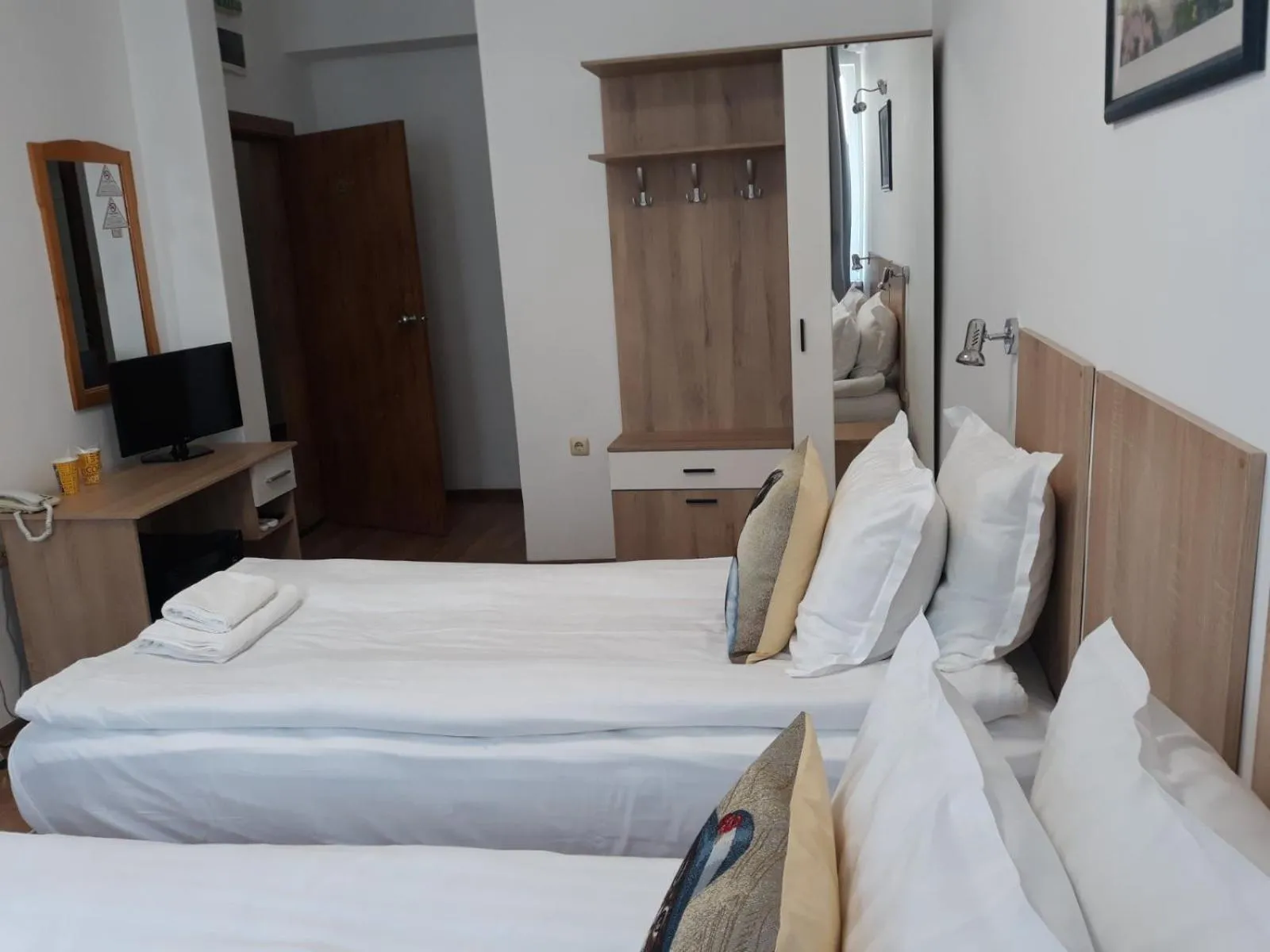 Bed in Three Dolphins Hotel with a Rooftop terracе