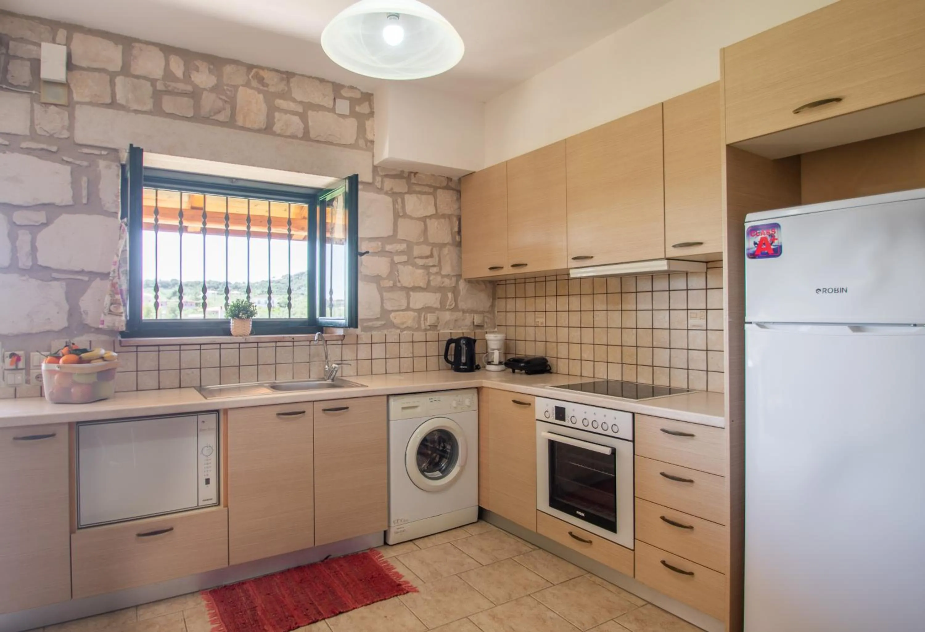 Kitchen or kitchenette in Ammos Zante Villas
