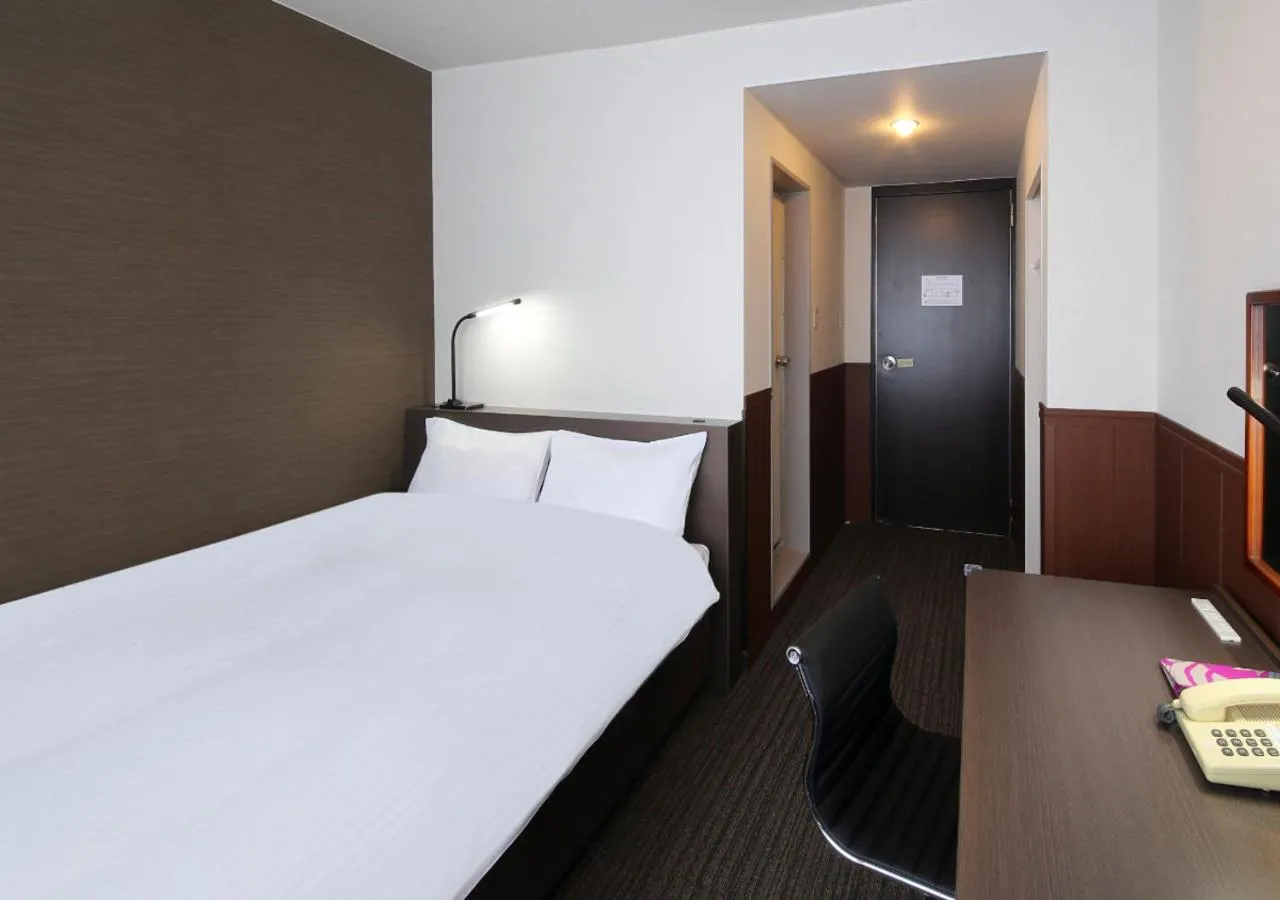 Bed in New Miyako Hotel Ashikaga Annex