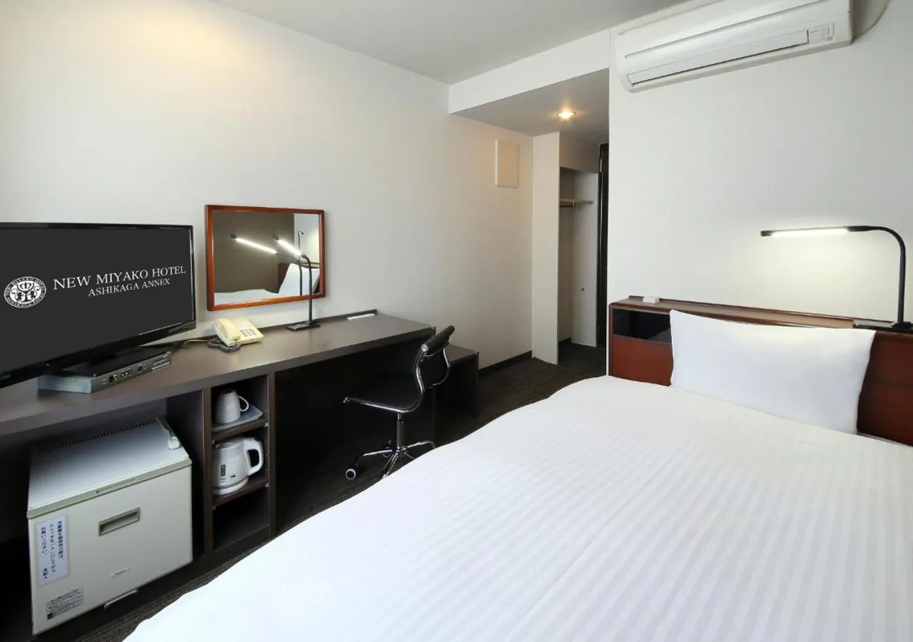Bed in New Miyako Hotel Ashikaga Annex
