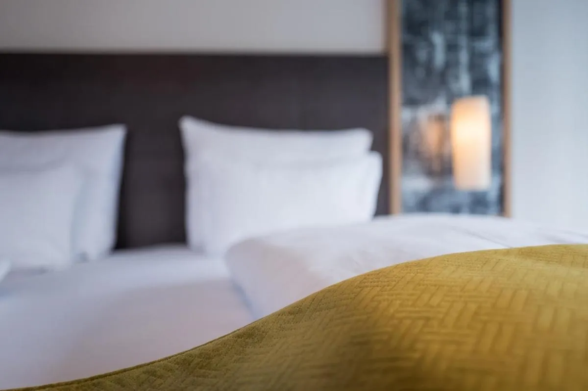 Bed in Arthur's Hotel und Apartments am Achensee