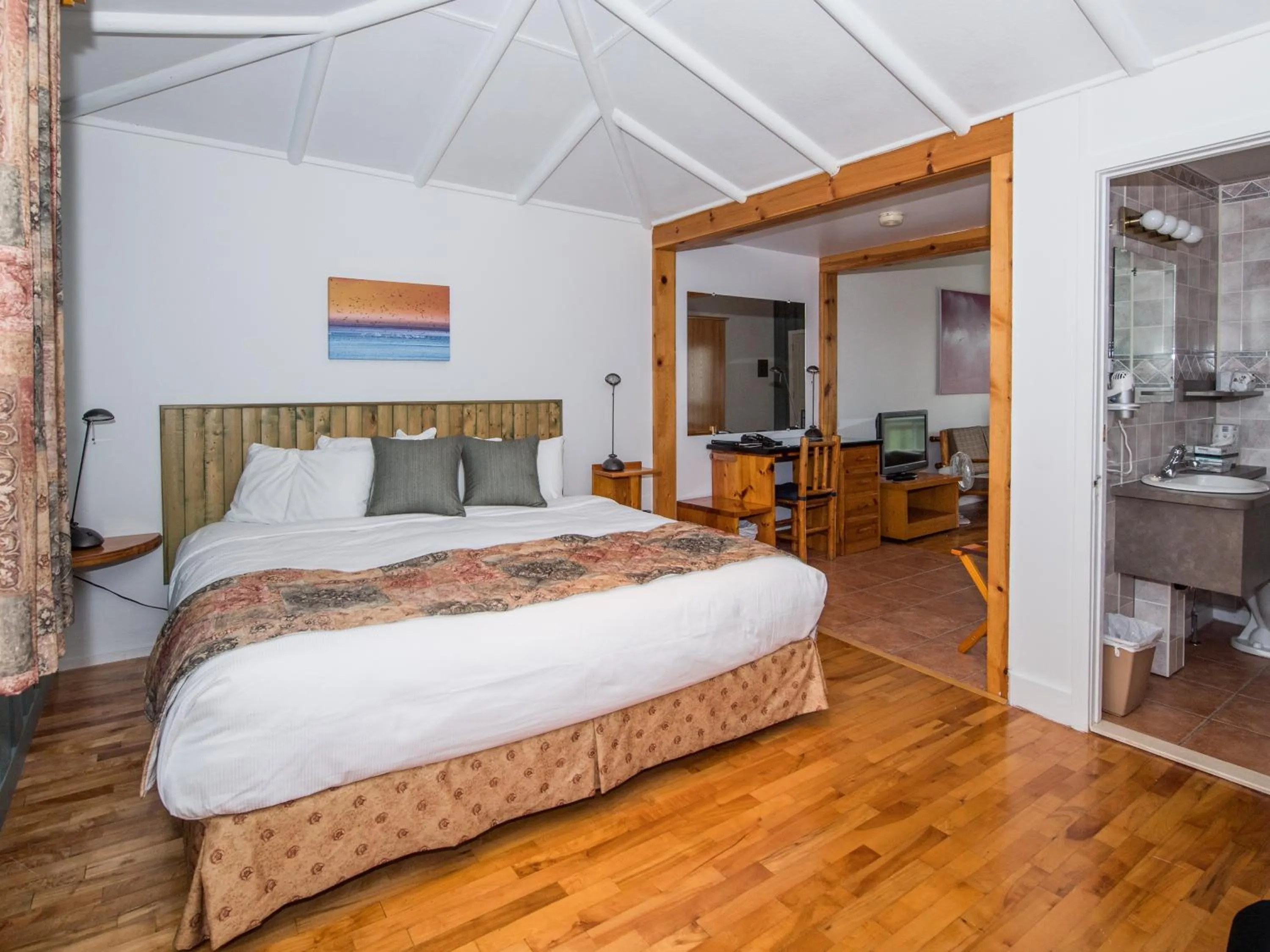 Bed in Au Pic de l'Aurore Motel-Chalets