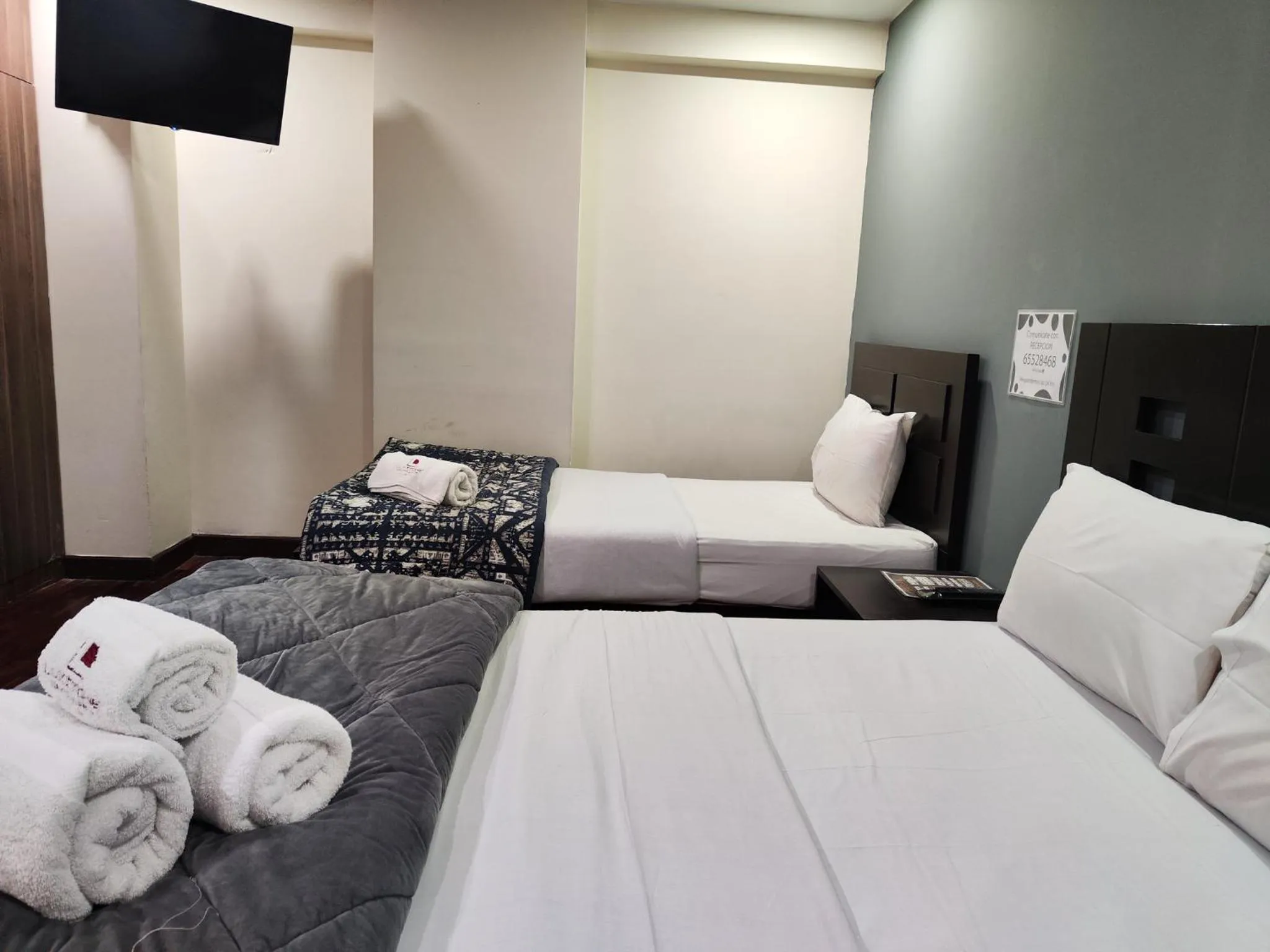 Bed in Luxstone Executive & Suites