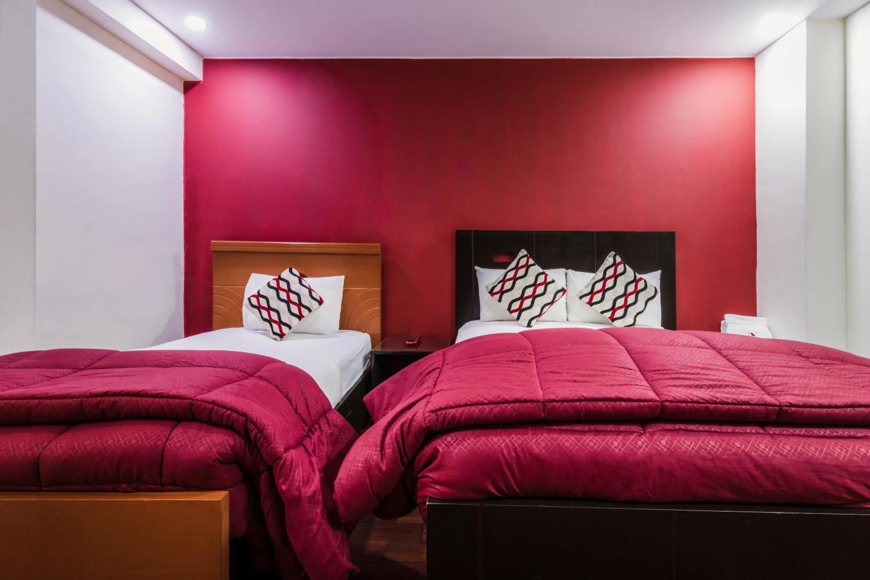 Bed in Luxstone Executive & Suites