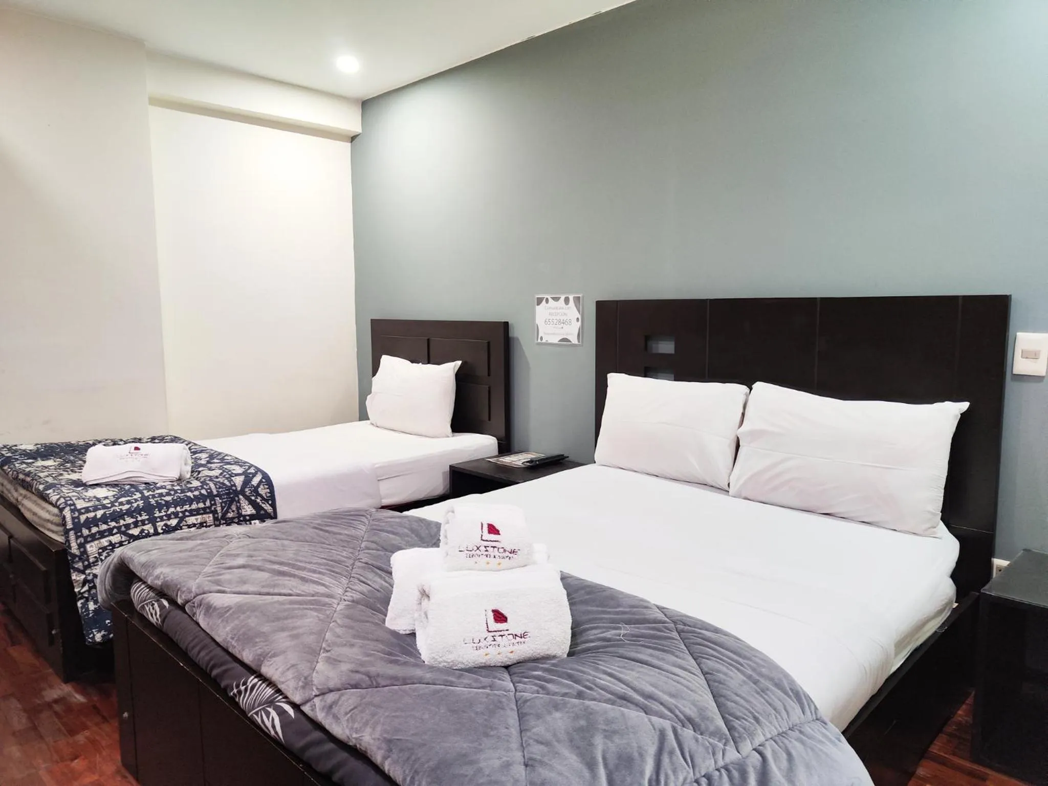 Bed in Luxstone Executive & Suites