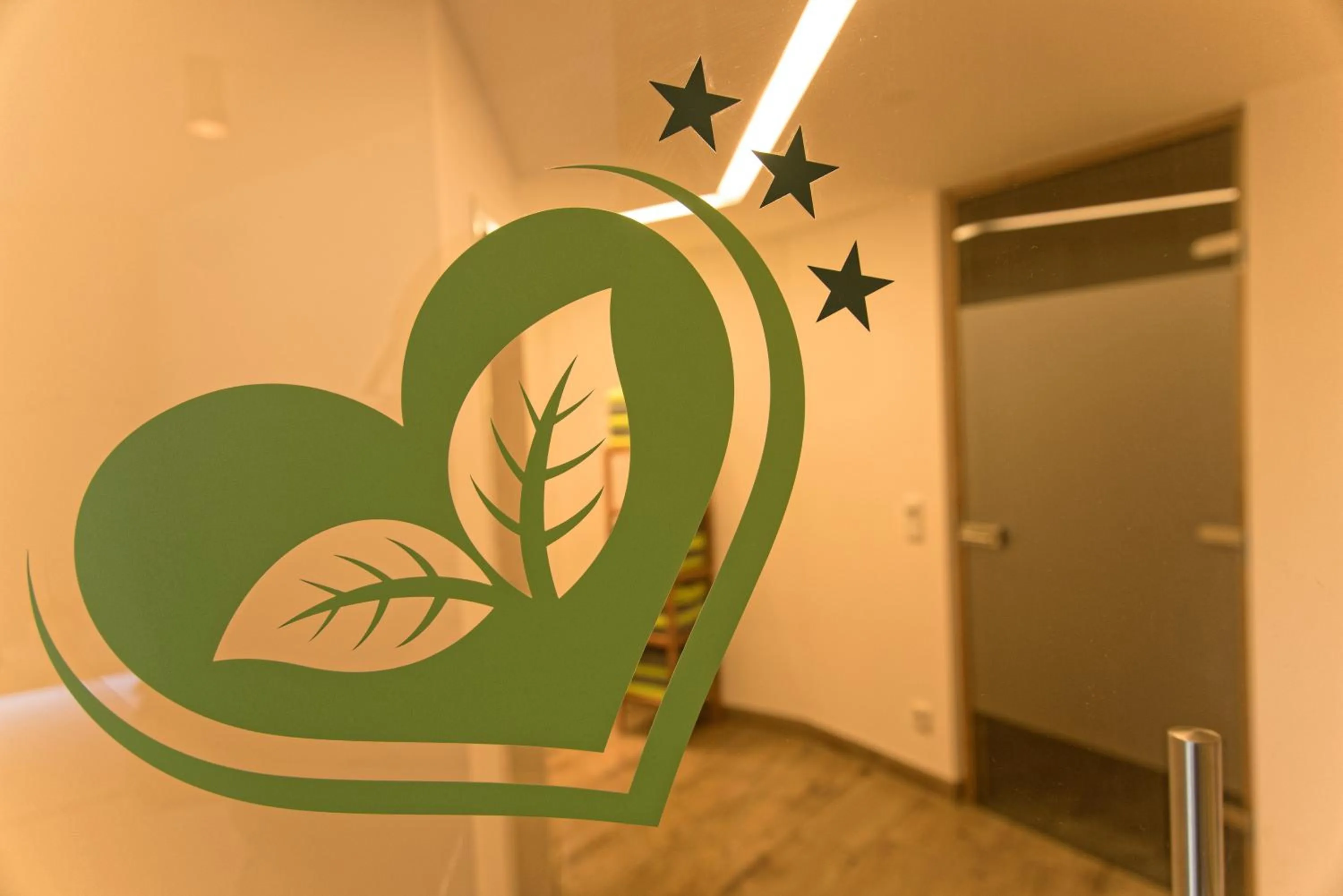 Property logo or sign in Hotel am Wiesenhang - Garni