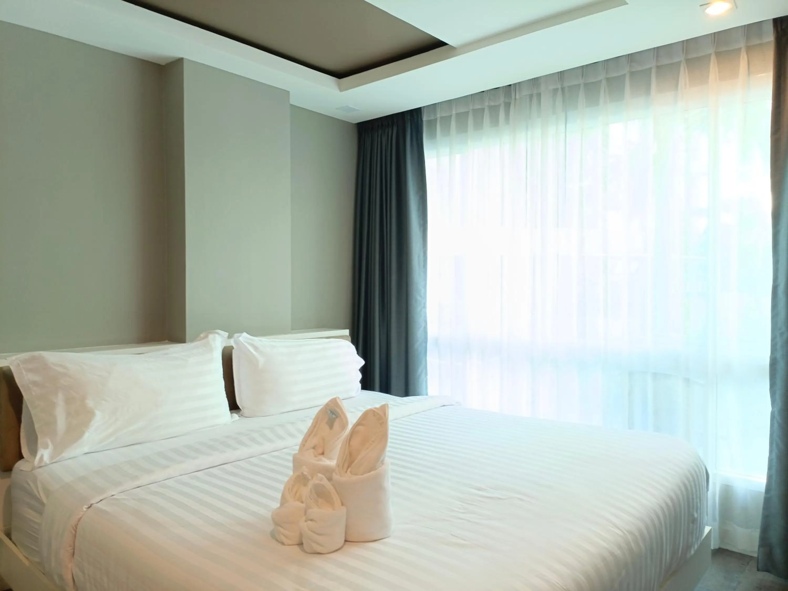 Bed in Wisdom Hotel & Residence