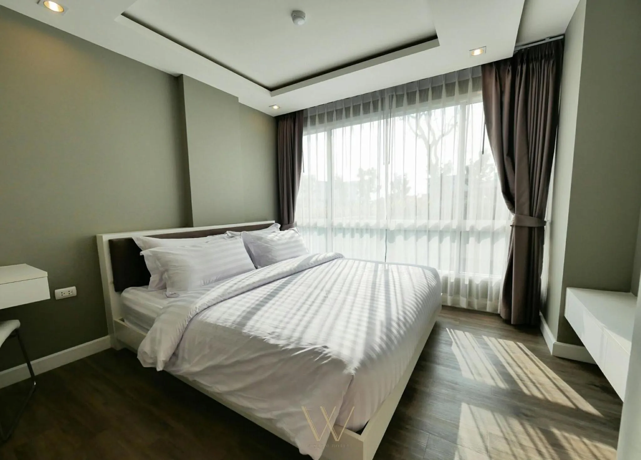 Bed in Wisdom Hotel & Residence