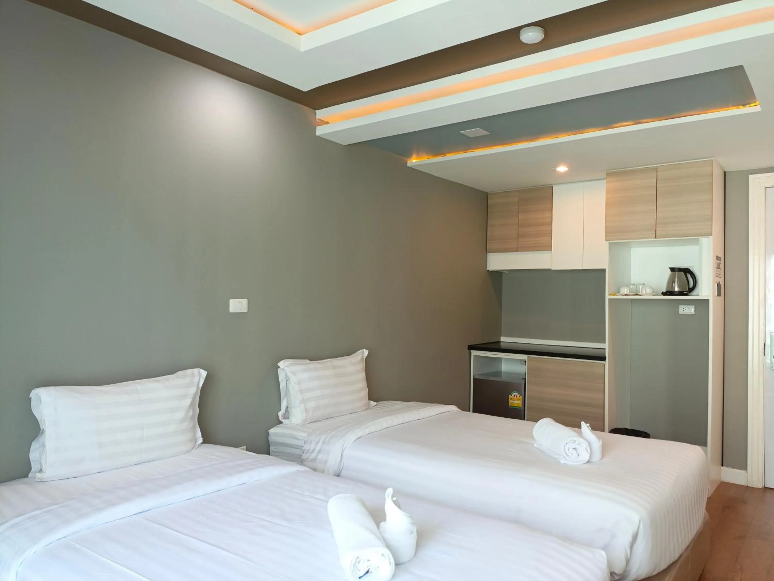 Bed in Wisdom Hotel & Residence