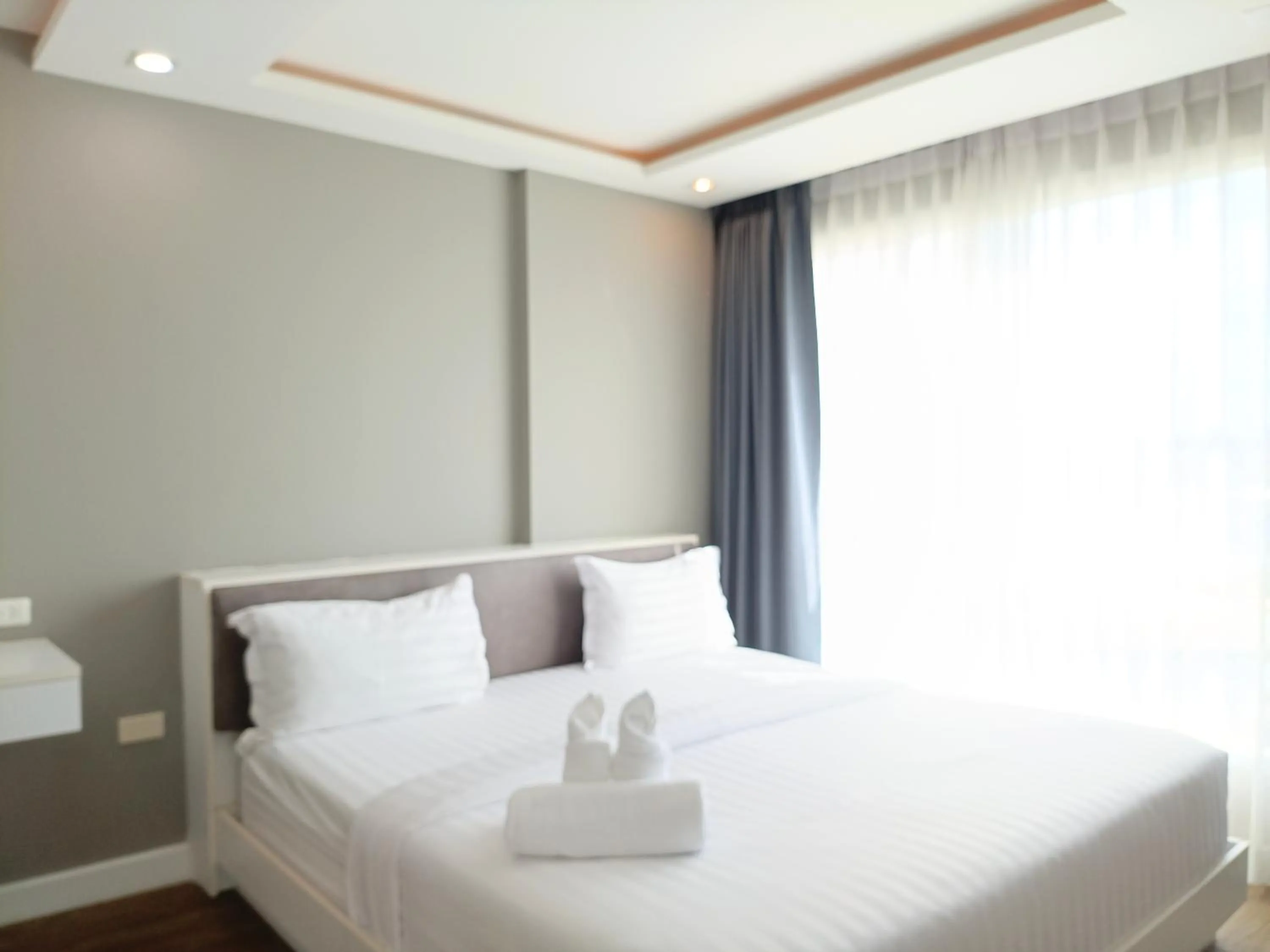 Bed in Wisdom Hotel & Residence