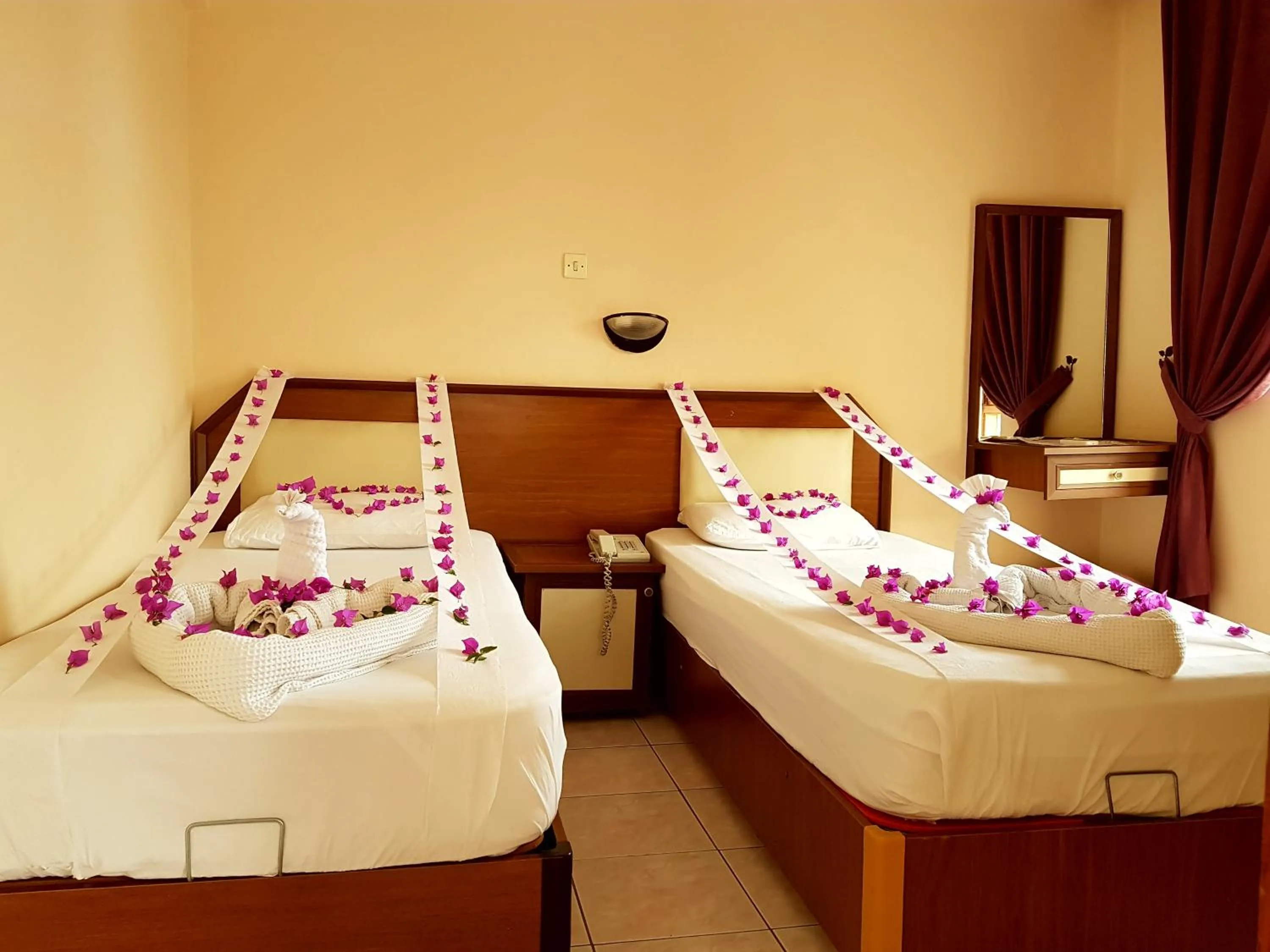 Bed in Palmen Apart Hotel