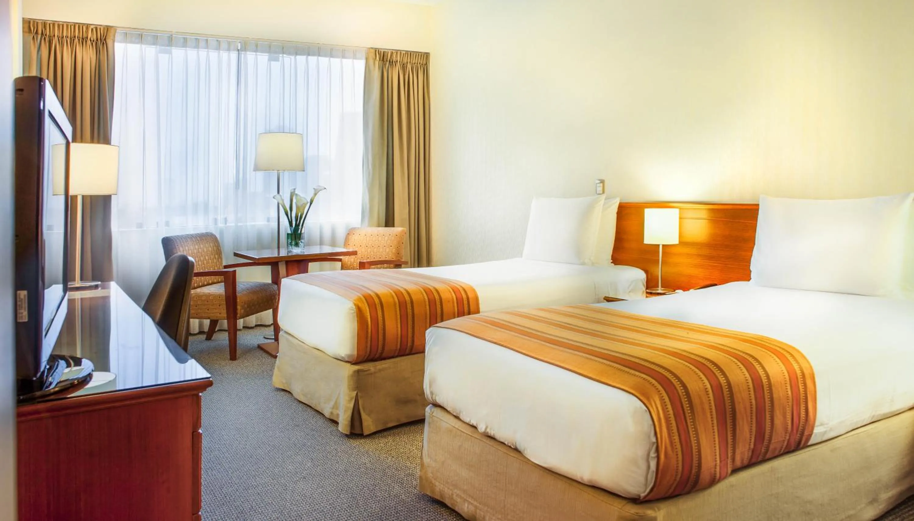 Seating area, Bed in Del Prado Hotel