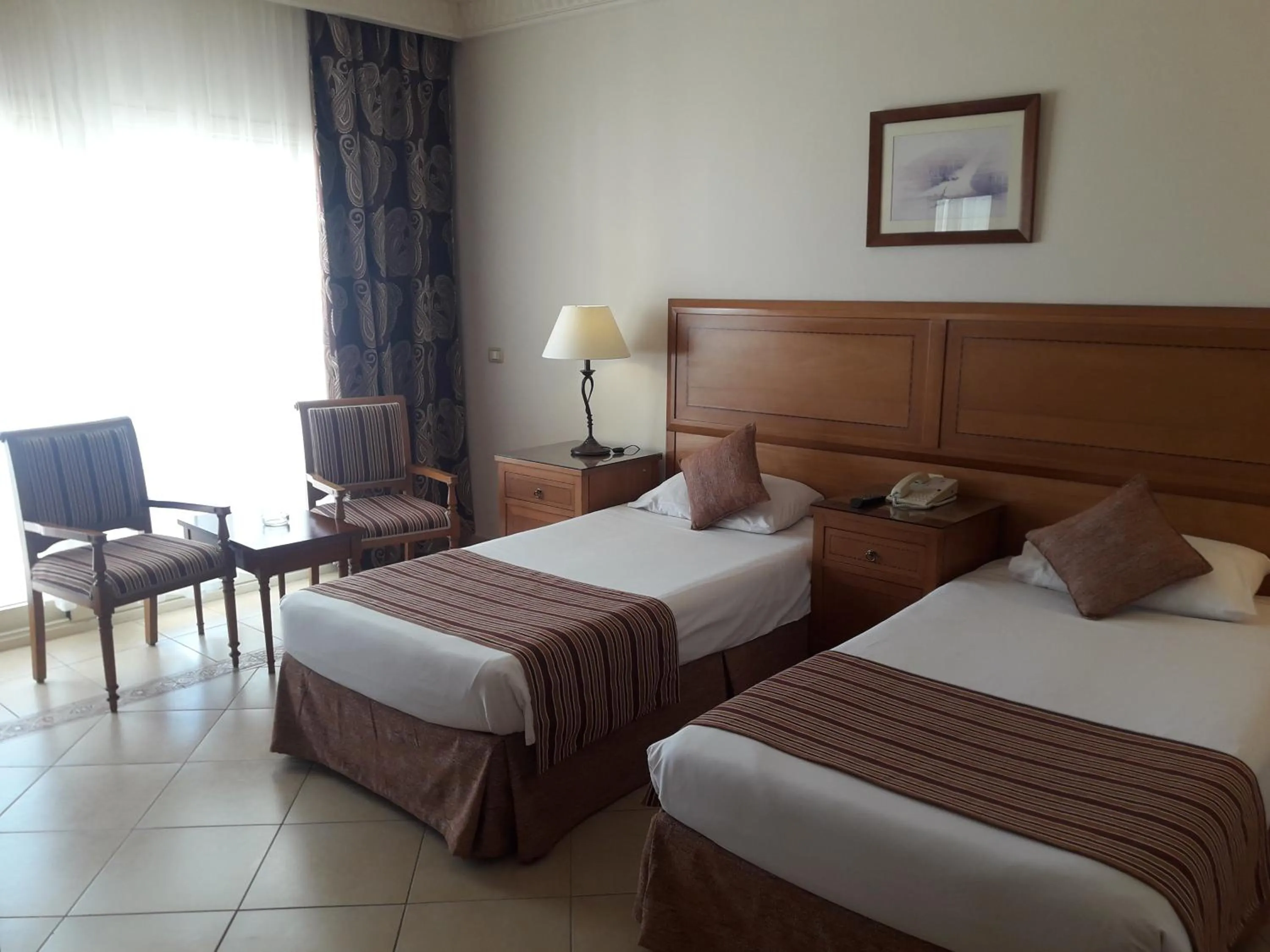 Bed in Continental Plaza Beach Resort