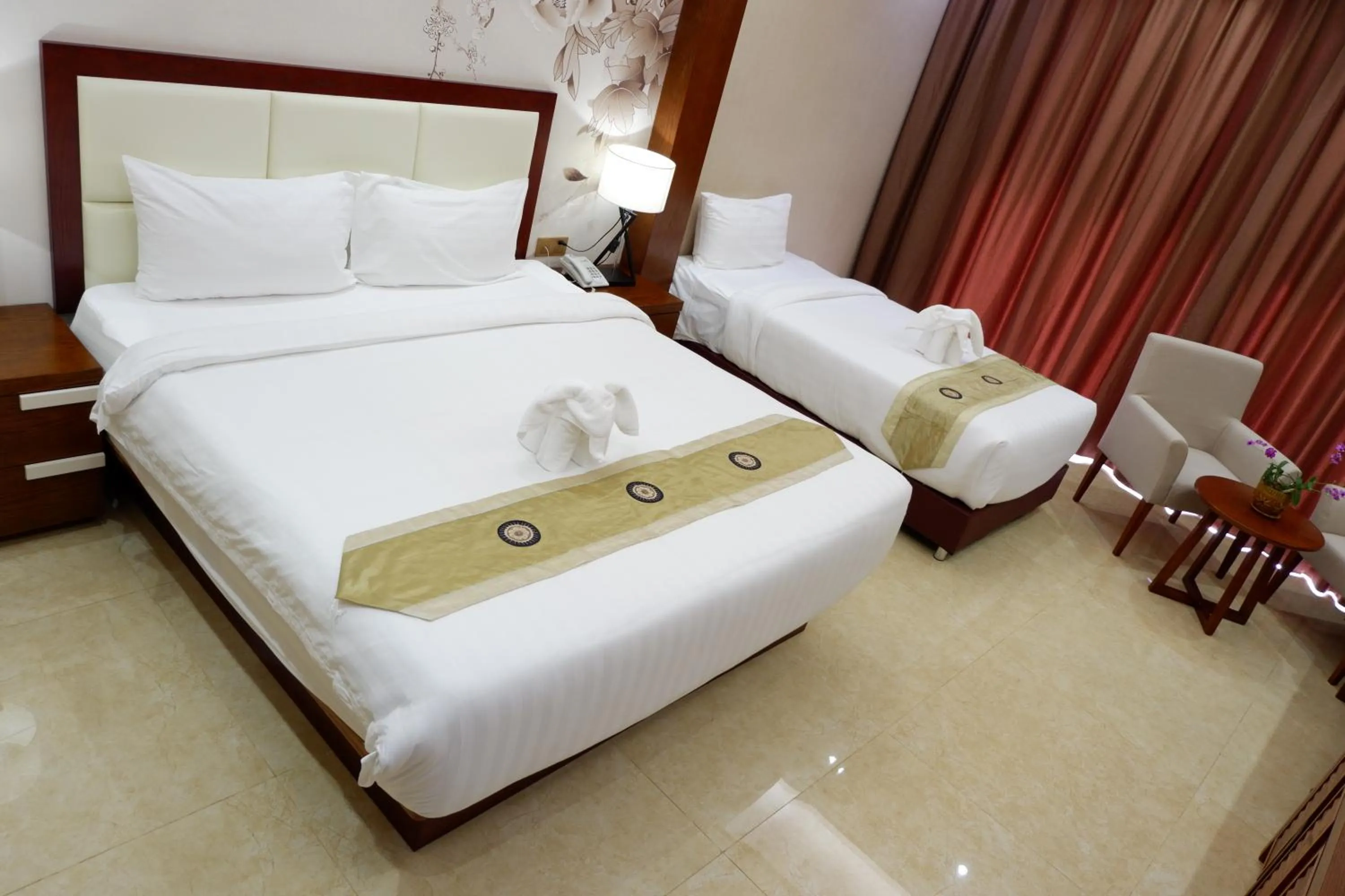 Bed in Paksong Danngarm Hotel