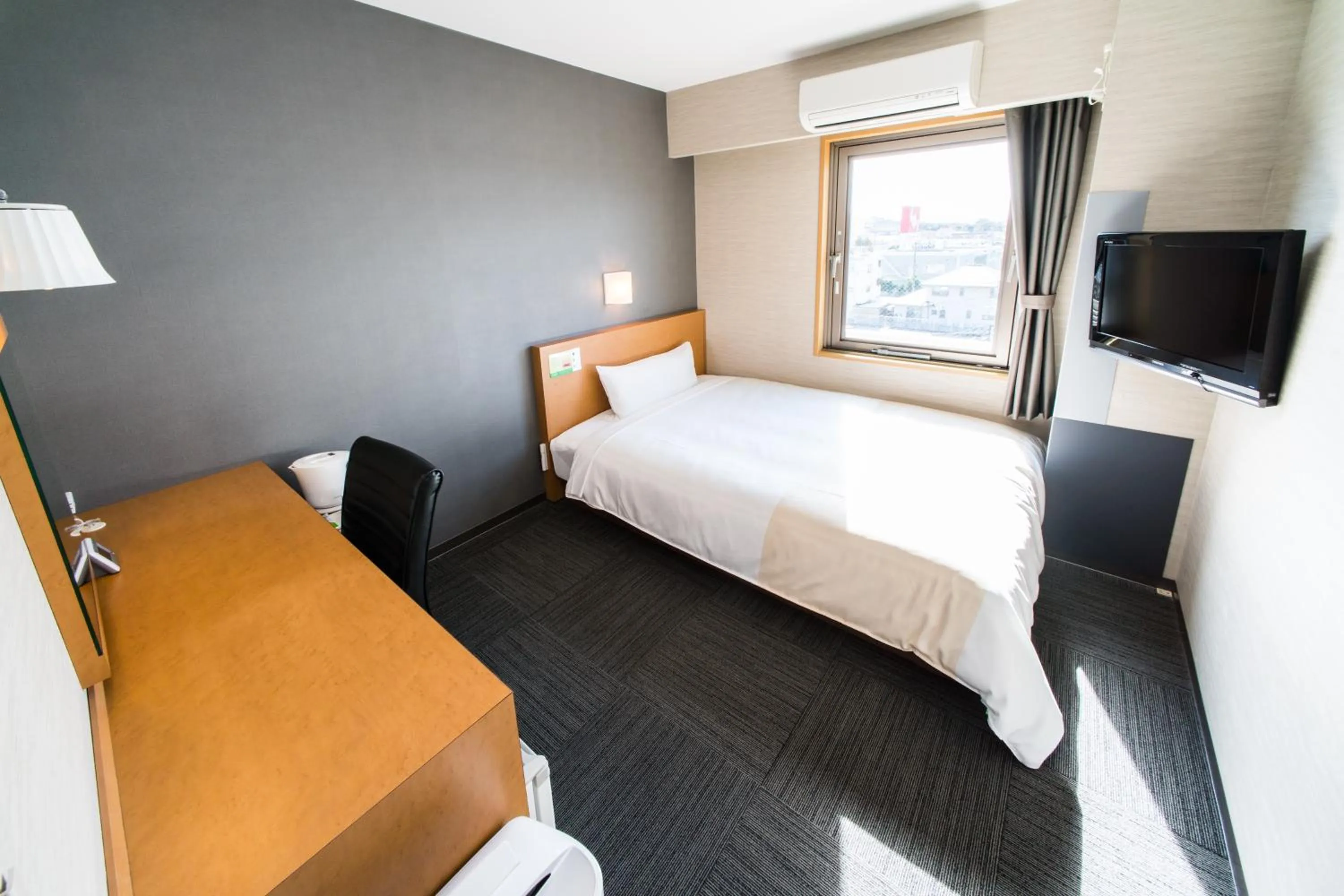 Bed in Super Hotel Minami Hikone Ekimae