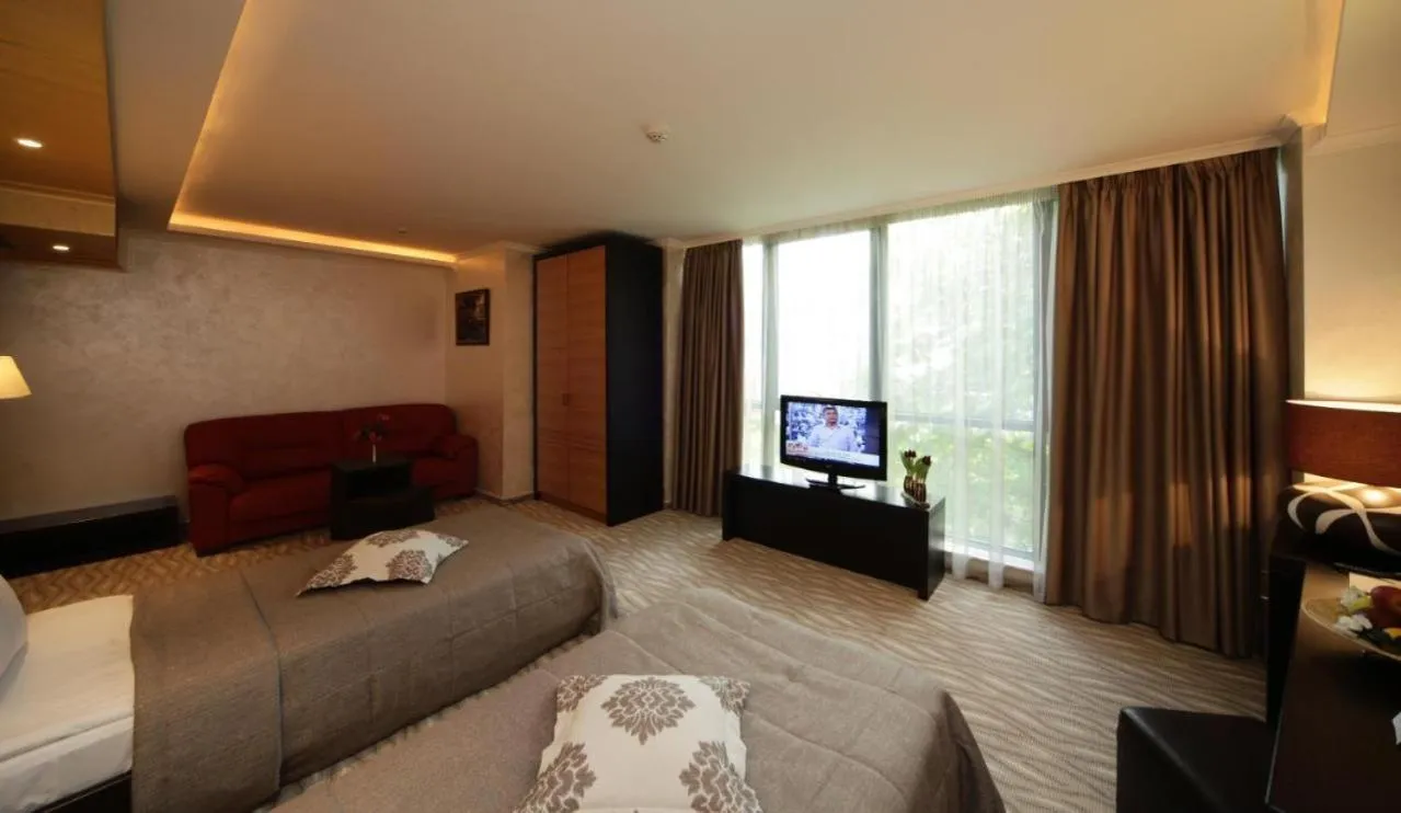 Communal lounge/ TV room, Bed in Efbet Hotel