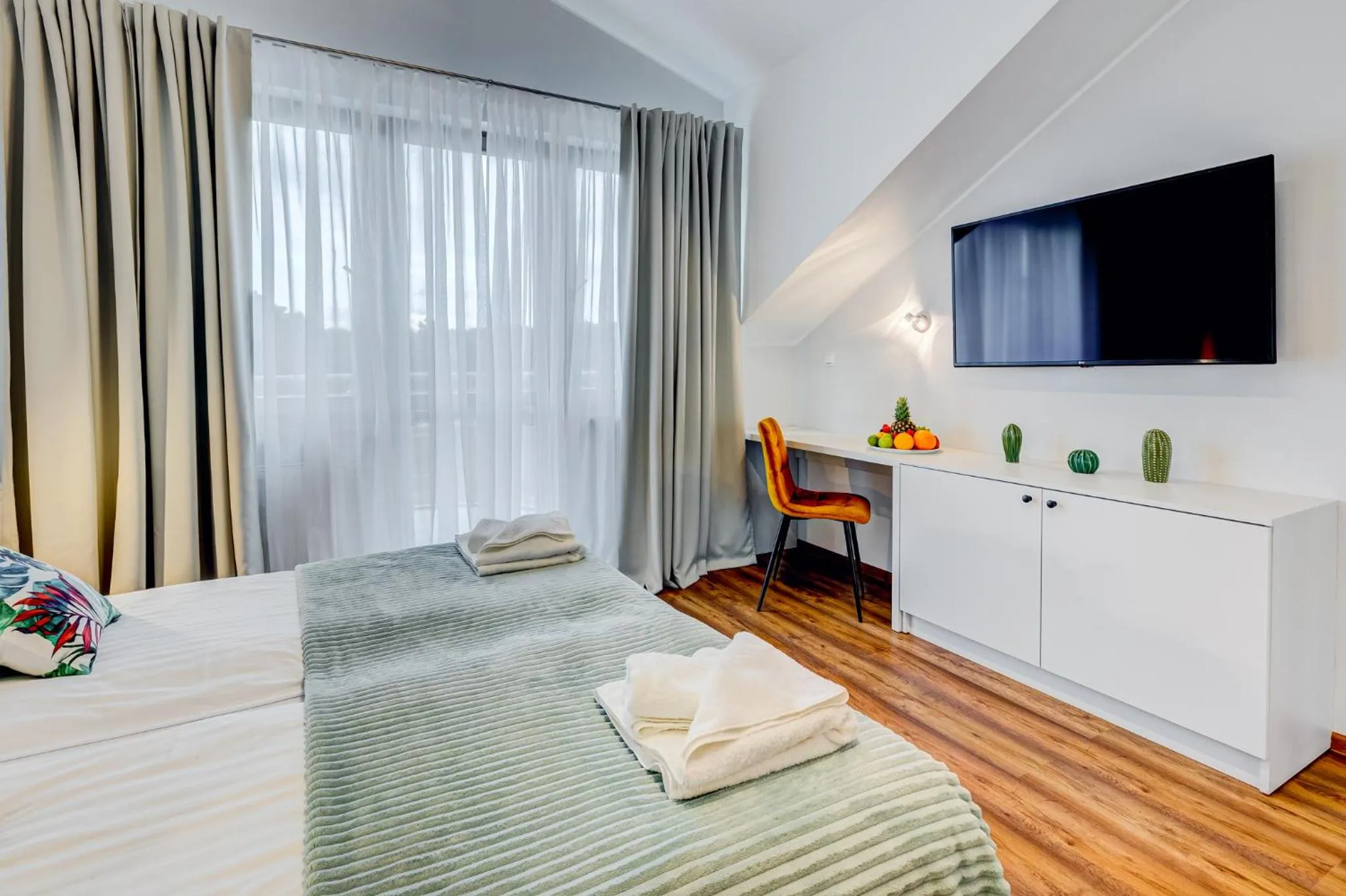 Communal lounge/ TV room, Bed in Apartamenty Zdrojowa