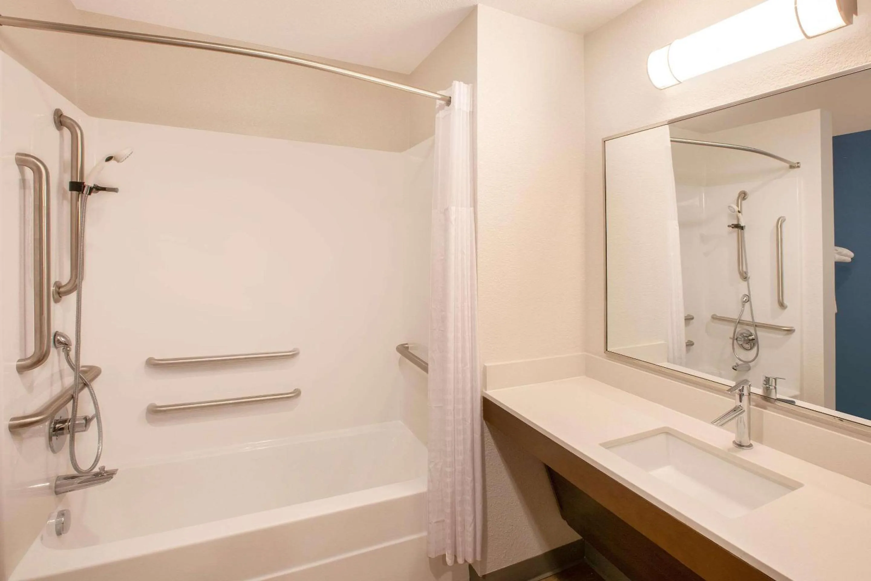 Bathroom in WoodSpring Suites Houston 288 South Medical Center