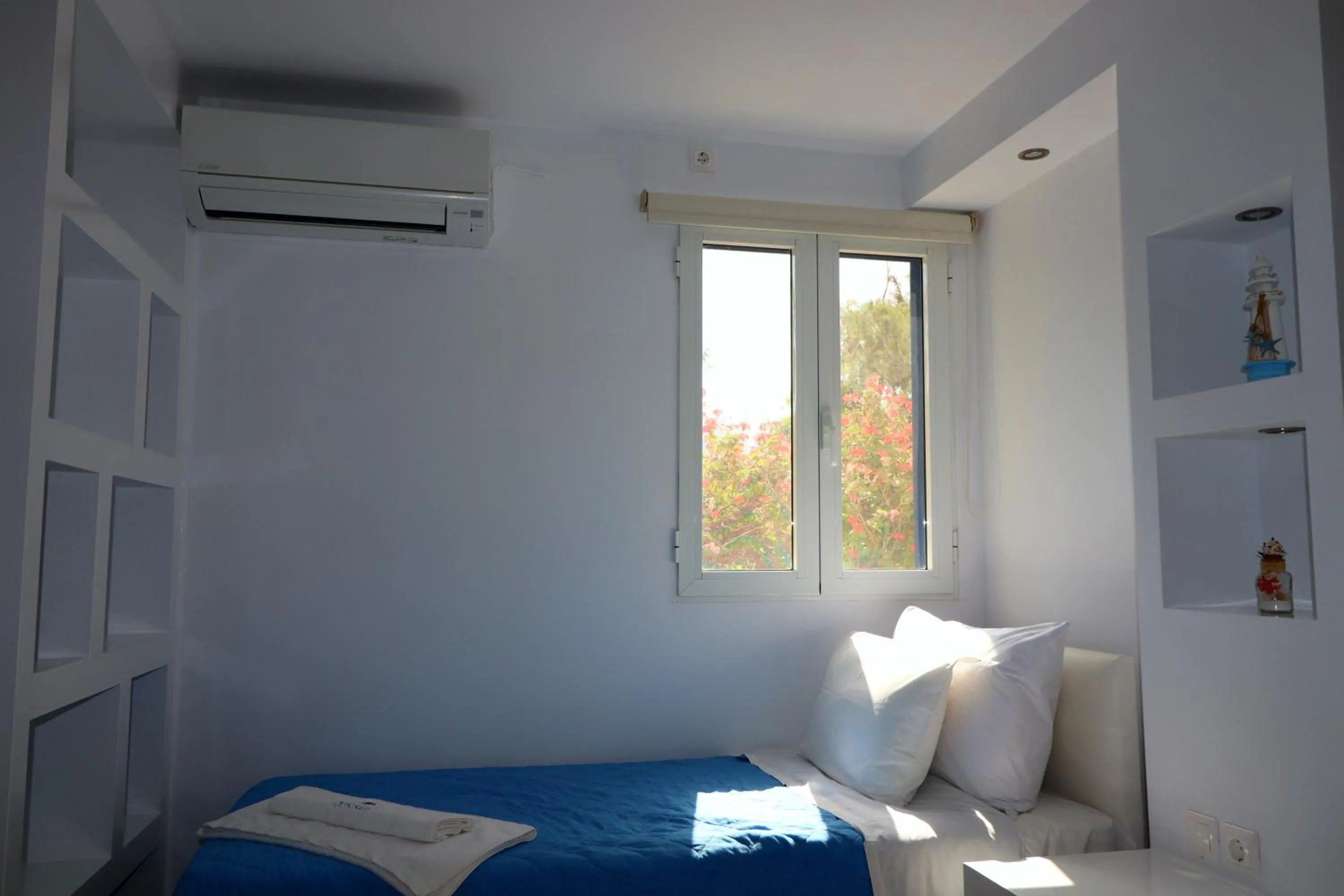 Bed in Coralli Beach Apartments