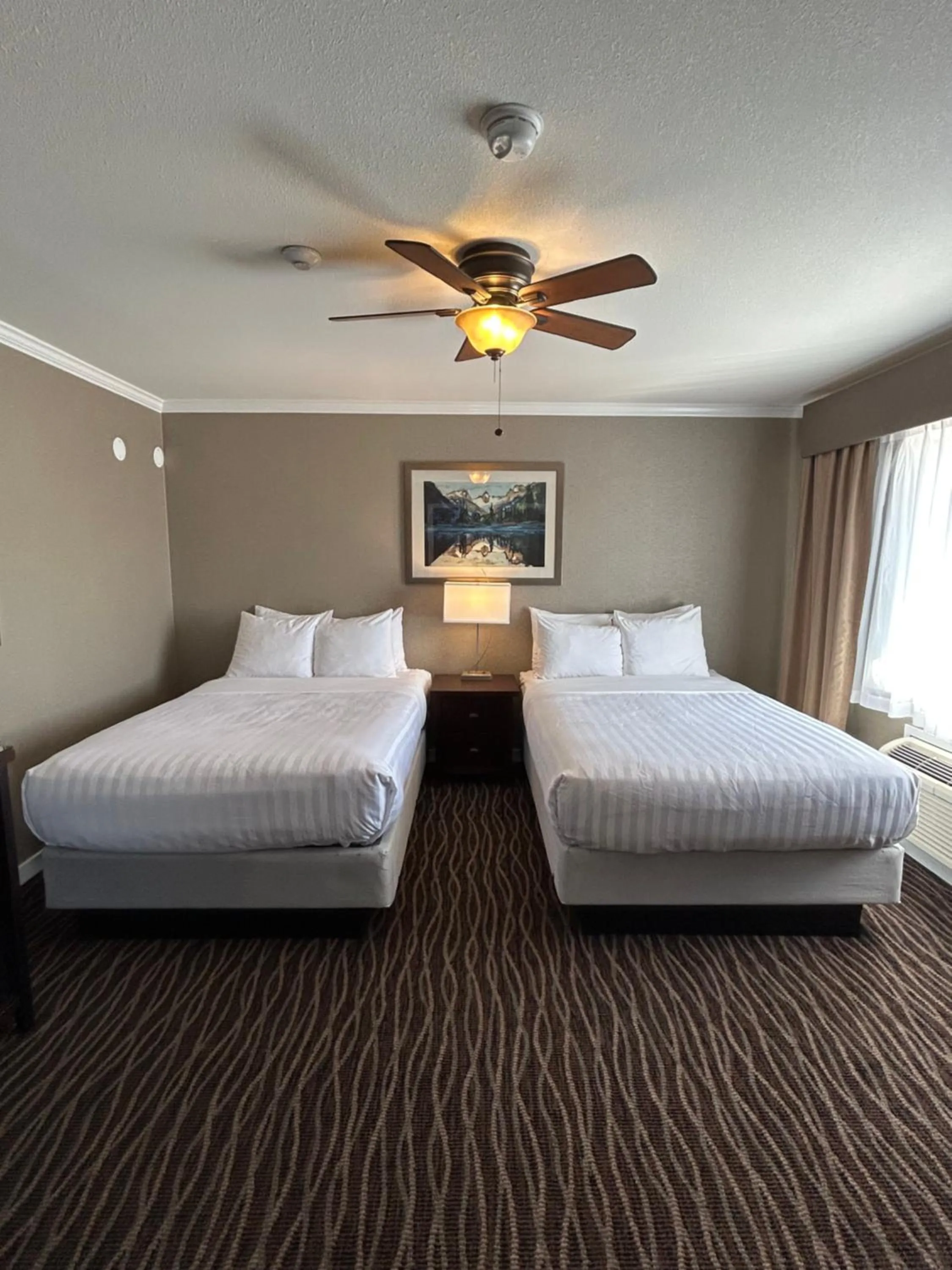 Bed in Prestige Radium Hot Springs Resort, WorldHotels Crafted