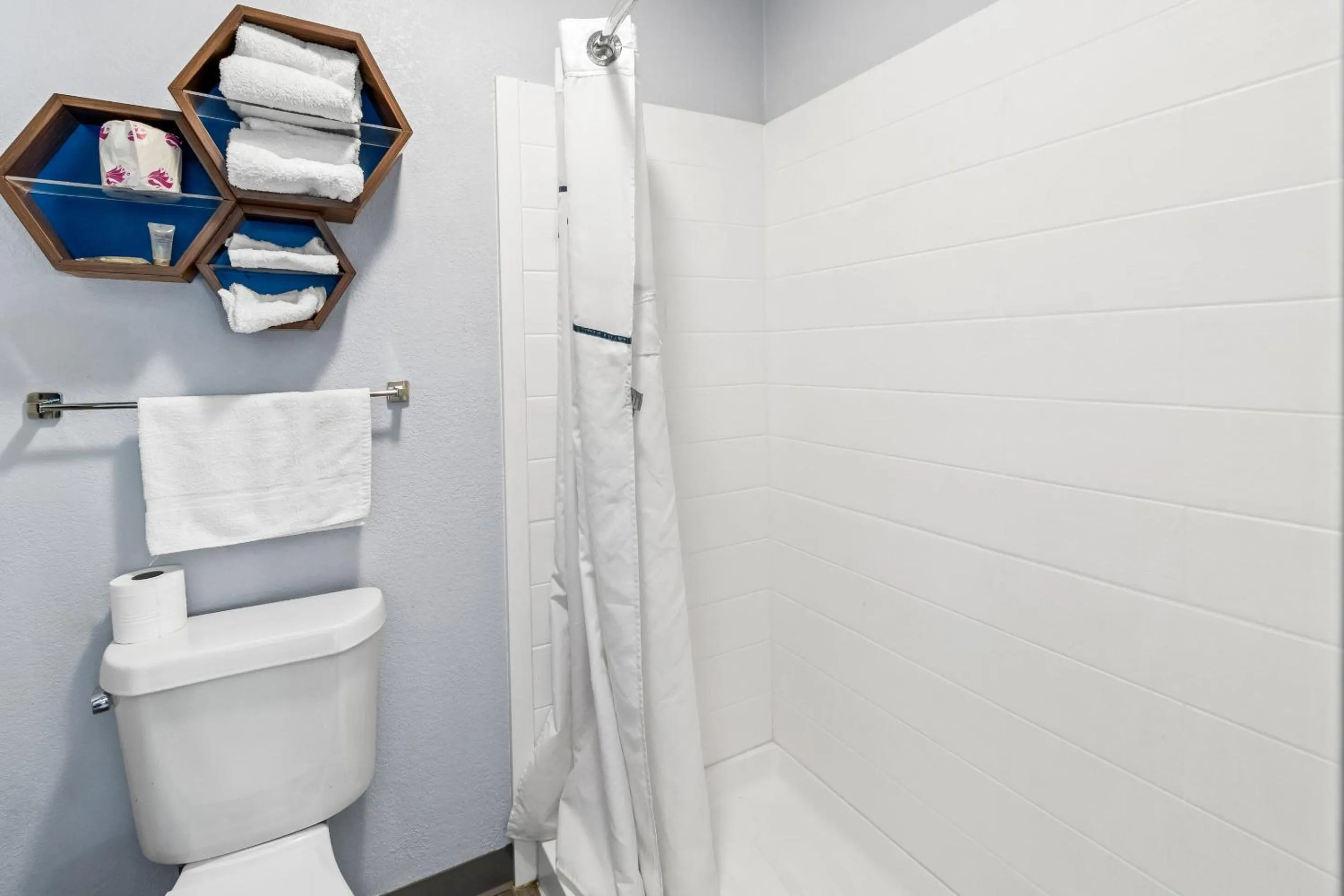 Shower in HomeTowne Studios by Red Roof Florence, KY-Cincinnati Airport