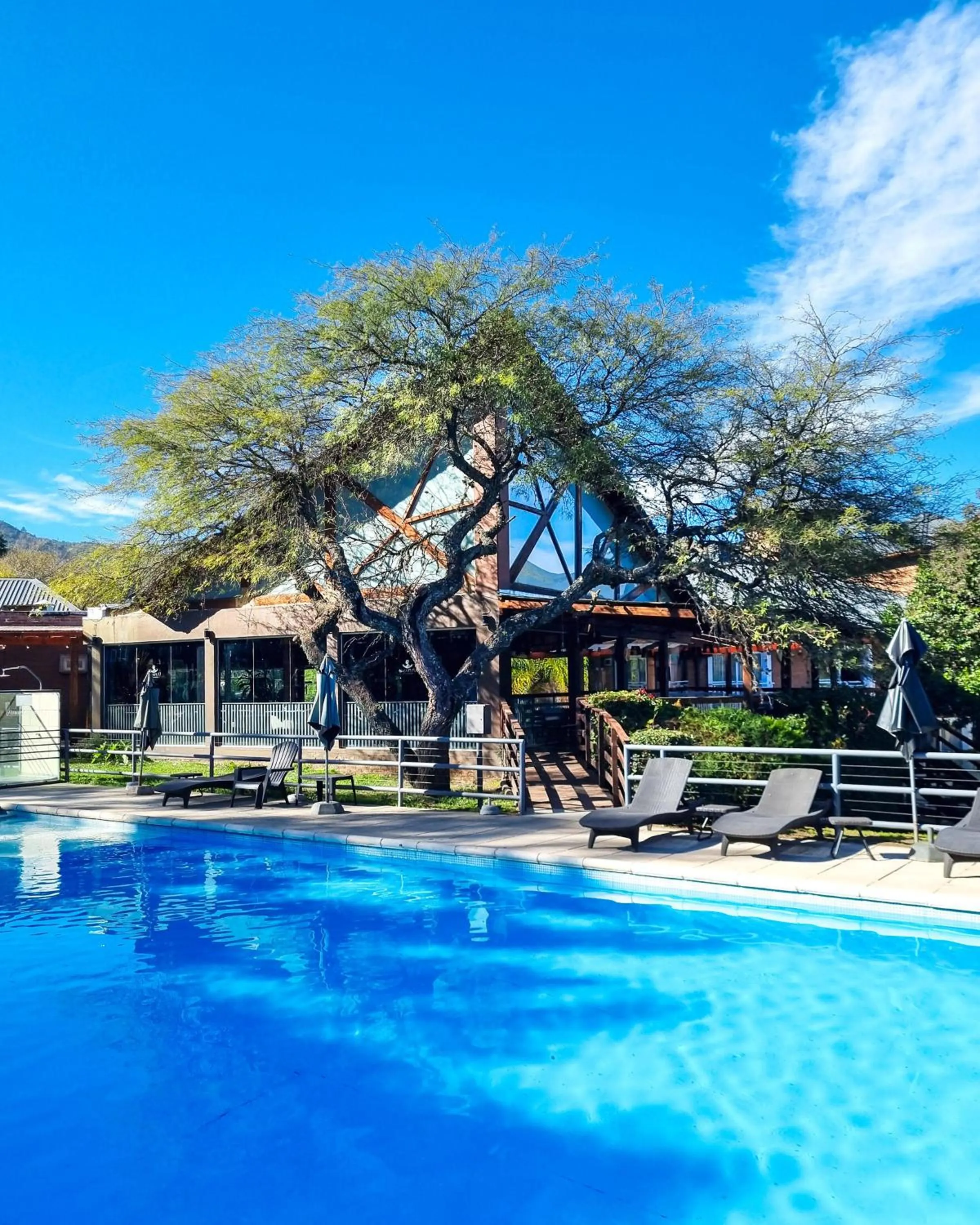 Swimming pool in Howard Johnson Hotel & Spa Villa General Belgrano