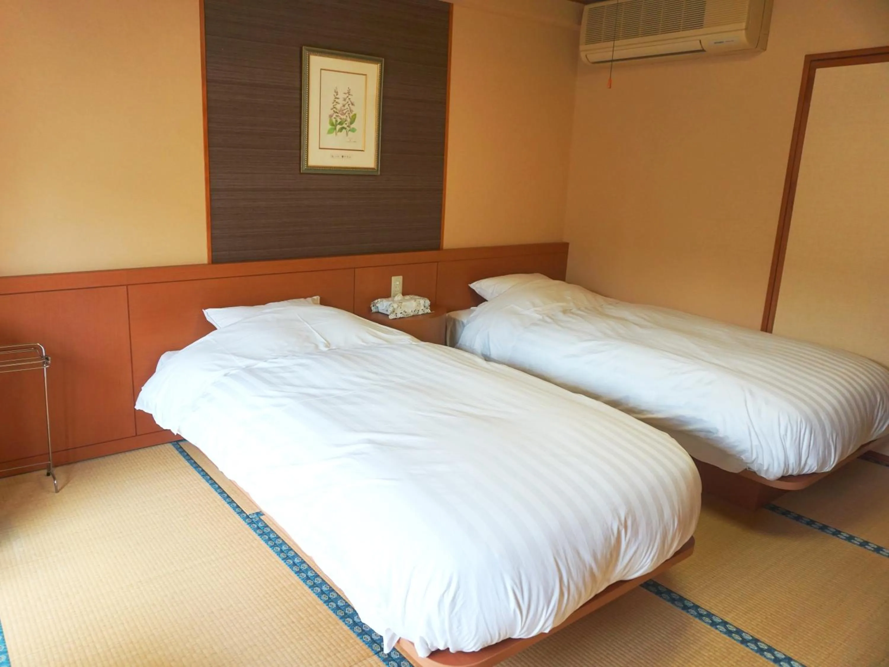 Bed in THE FOREST AKAN Tsuruga Resort