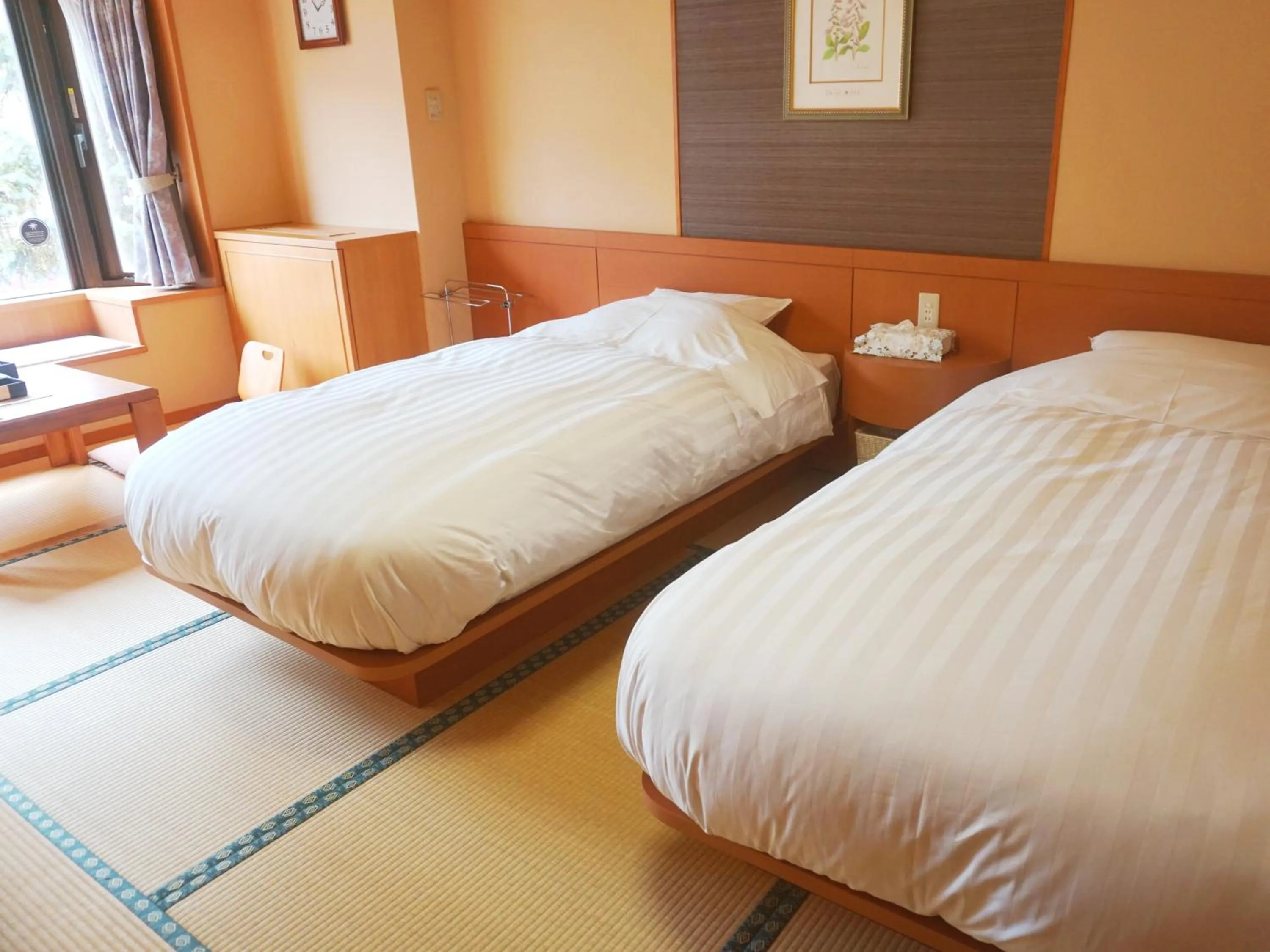 Bed in THE FOREST AKAN Tsuruga Resort