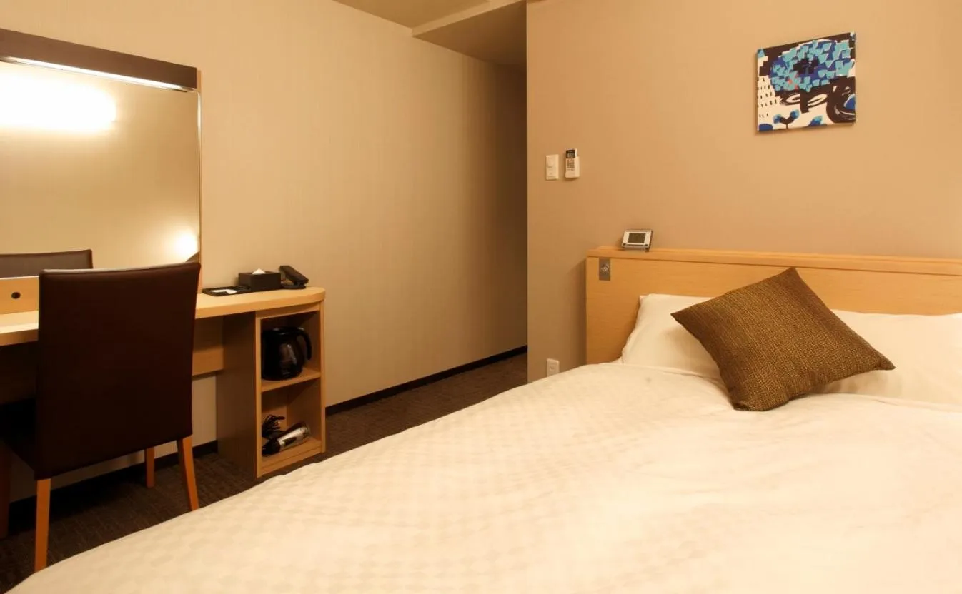 Bed in Green Sky Hotel Takehara