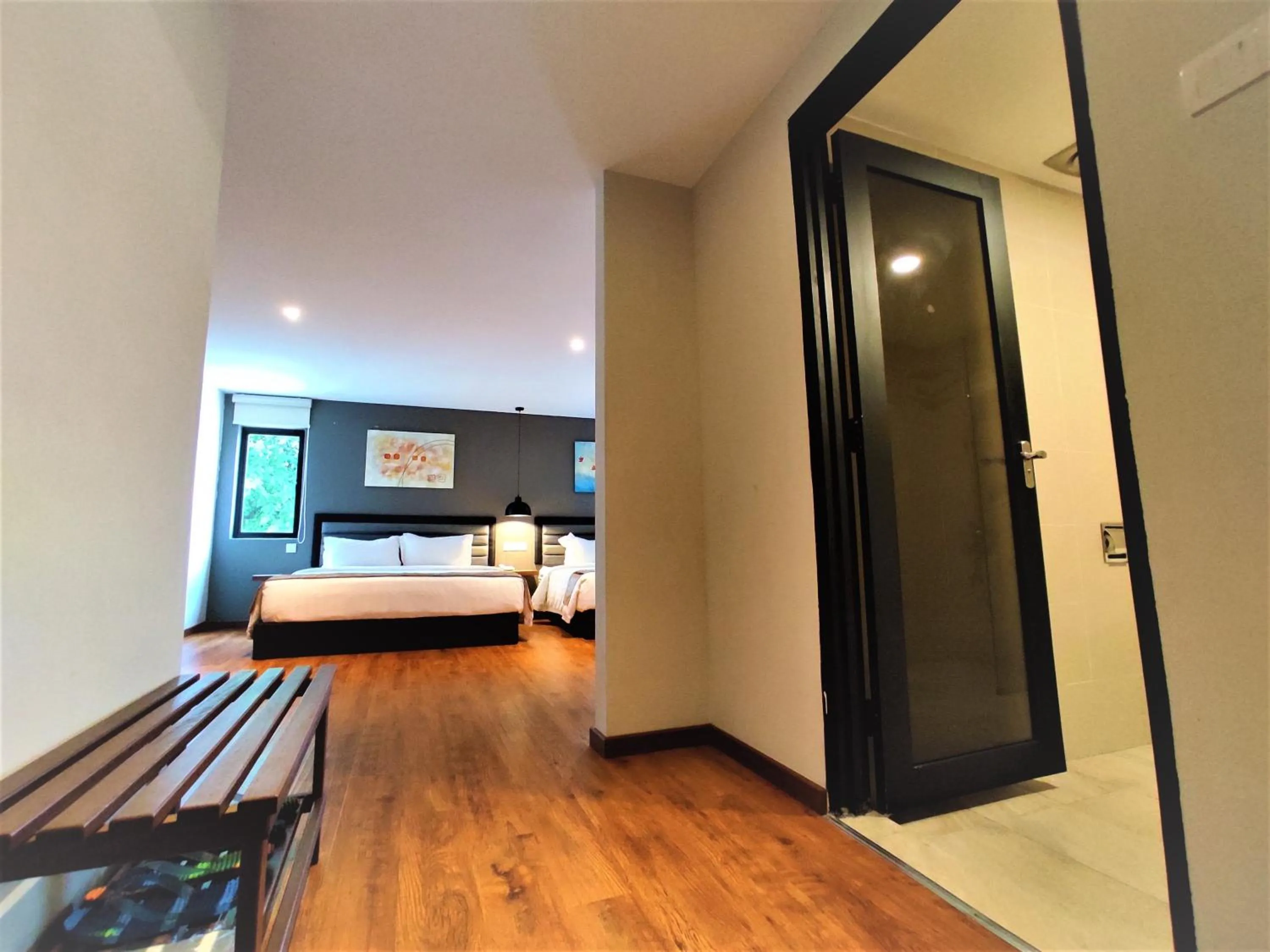 Living room, Bed in Apple Suites Hotel