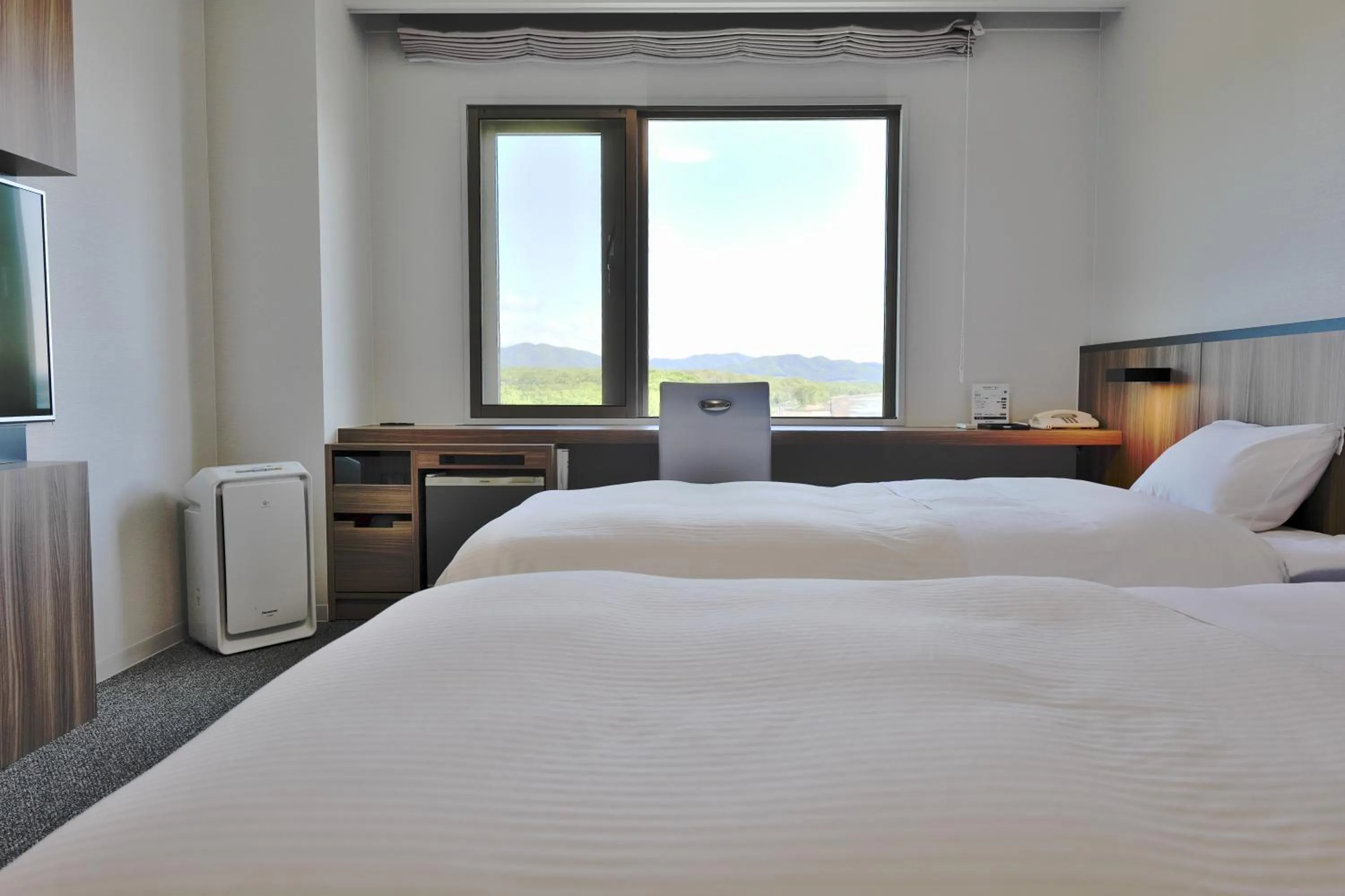 View (from property/room), Bed in Lake Saroma Tsuruga Resort