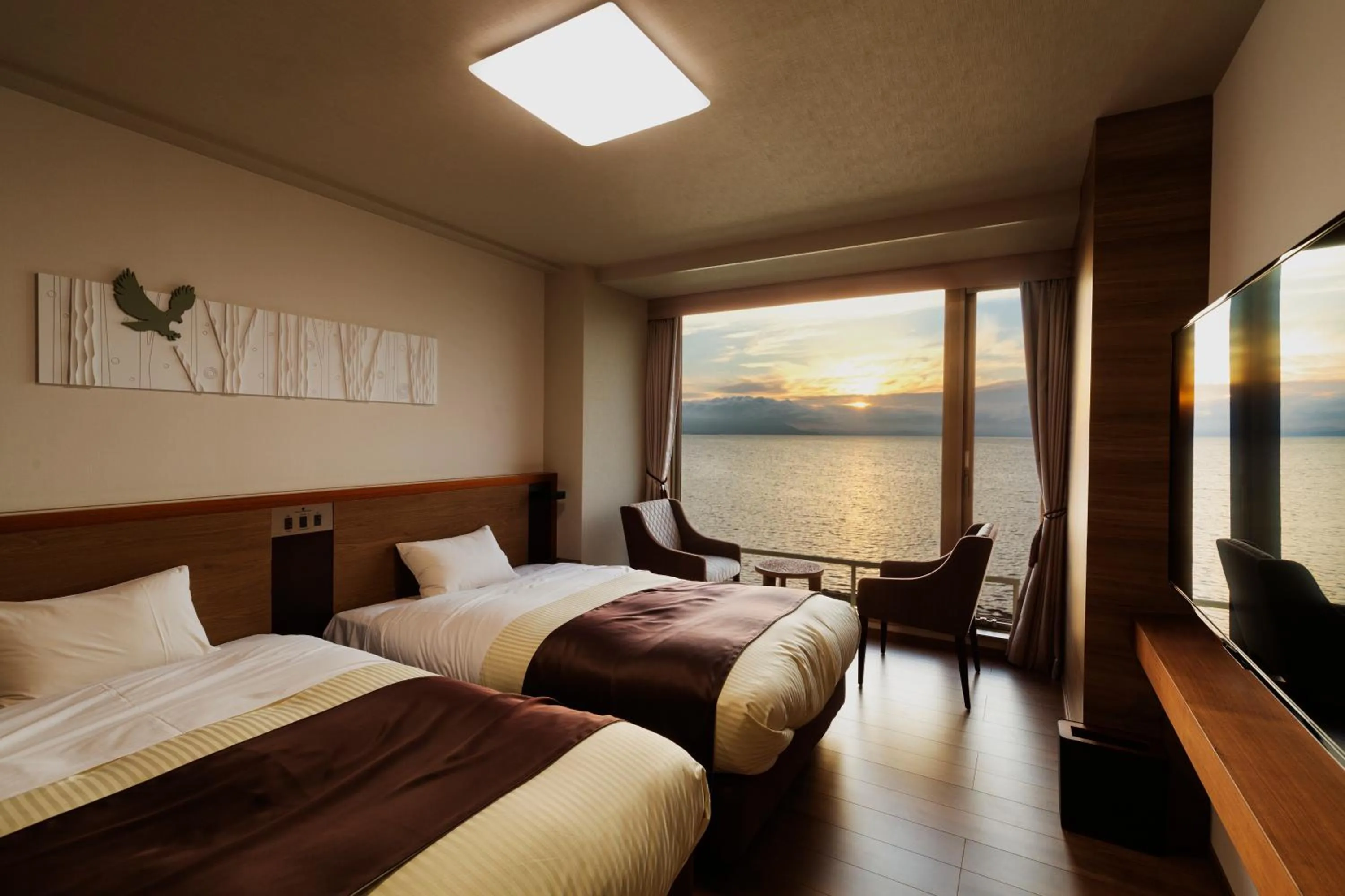 Photo of the whole room, Bed in Lake Saroma Tsuruga Resort