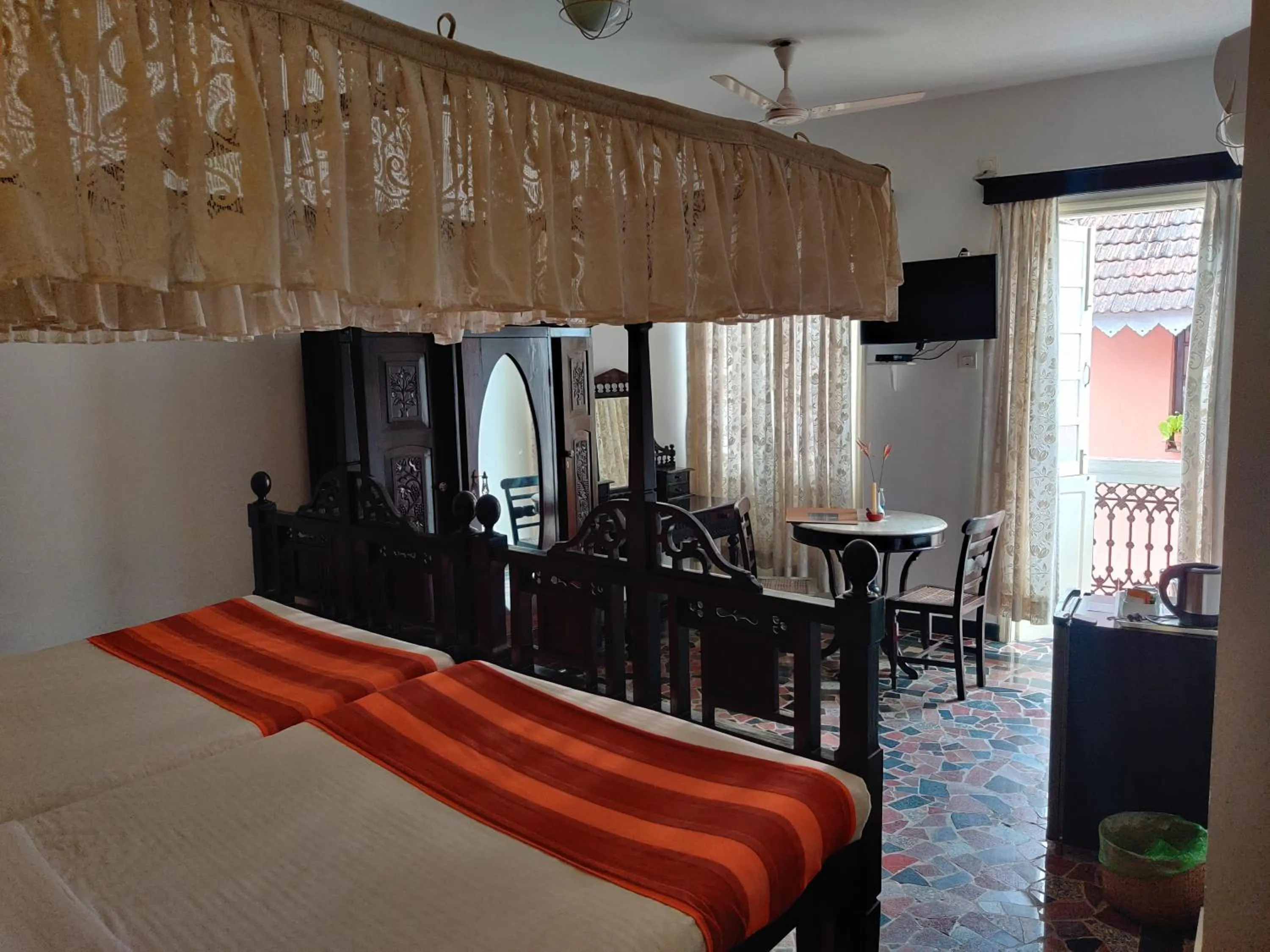 Bed in WelcomHeritage Panjim Inn