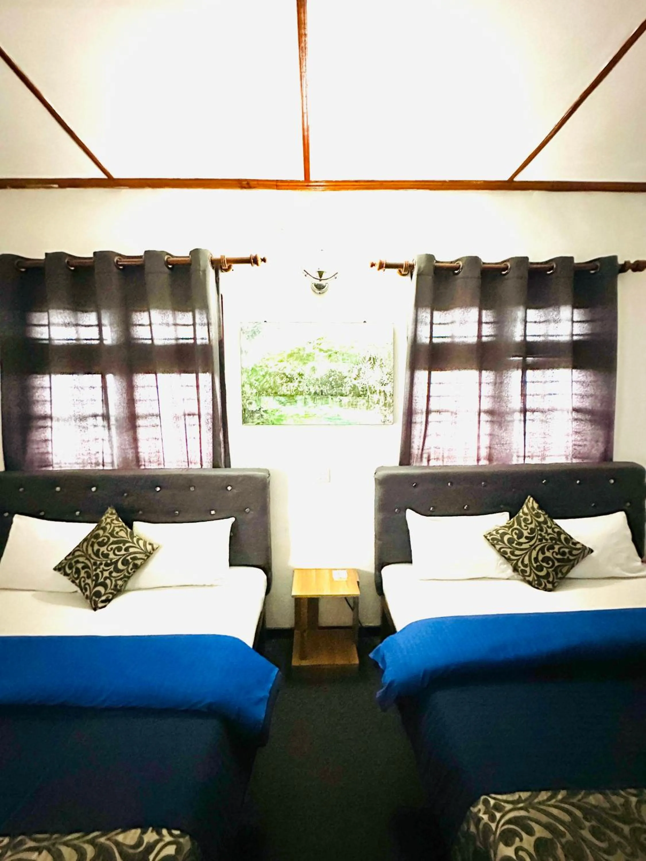 Bed in New Royal Mount Hotel