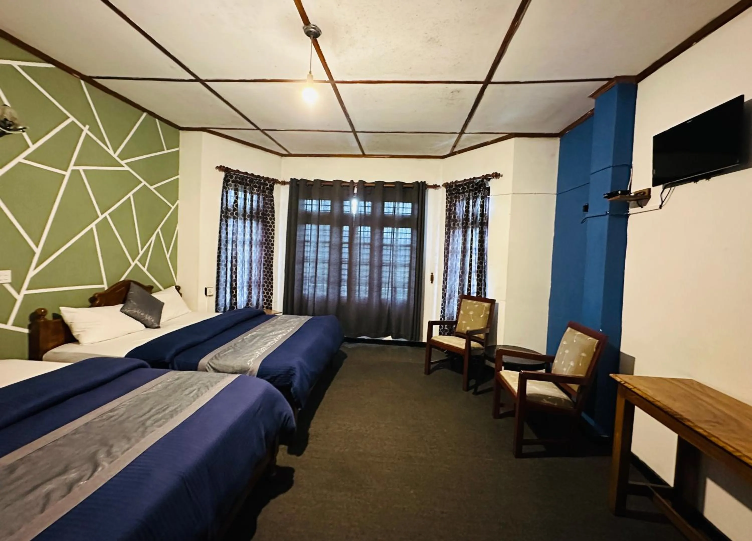 Bed in New Royal Mount Hotel