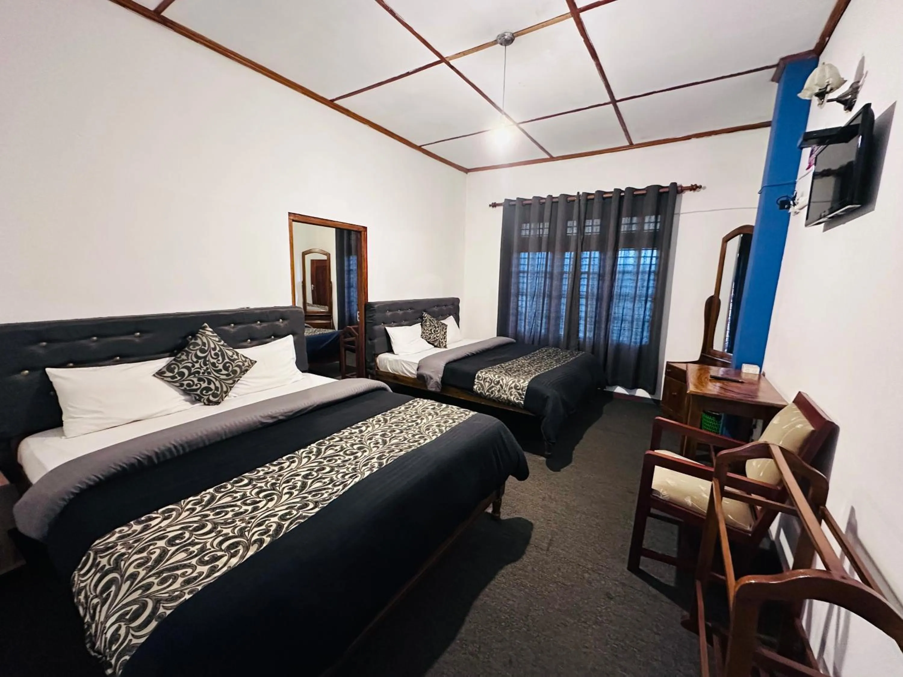 Bed in New Royal Mount Hotel