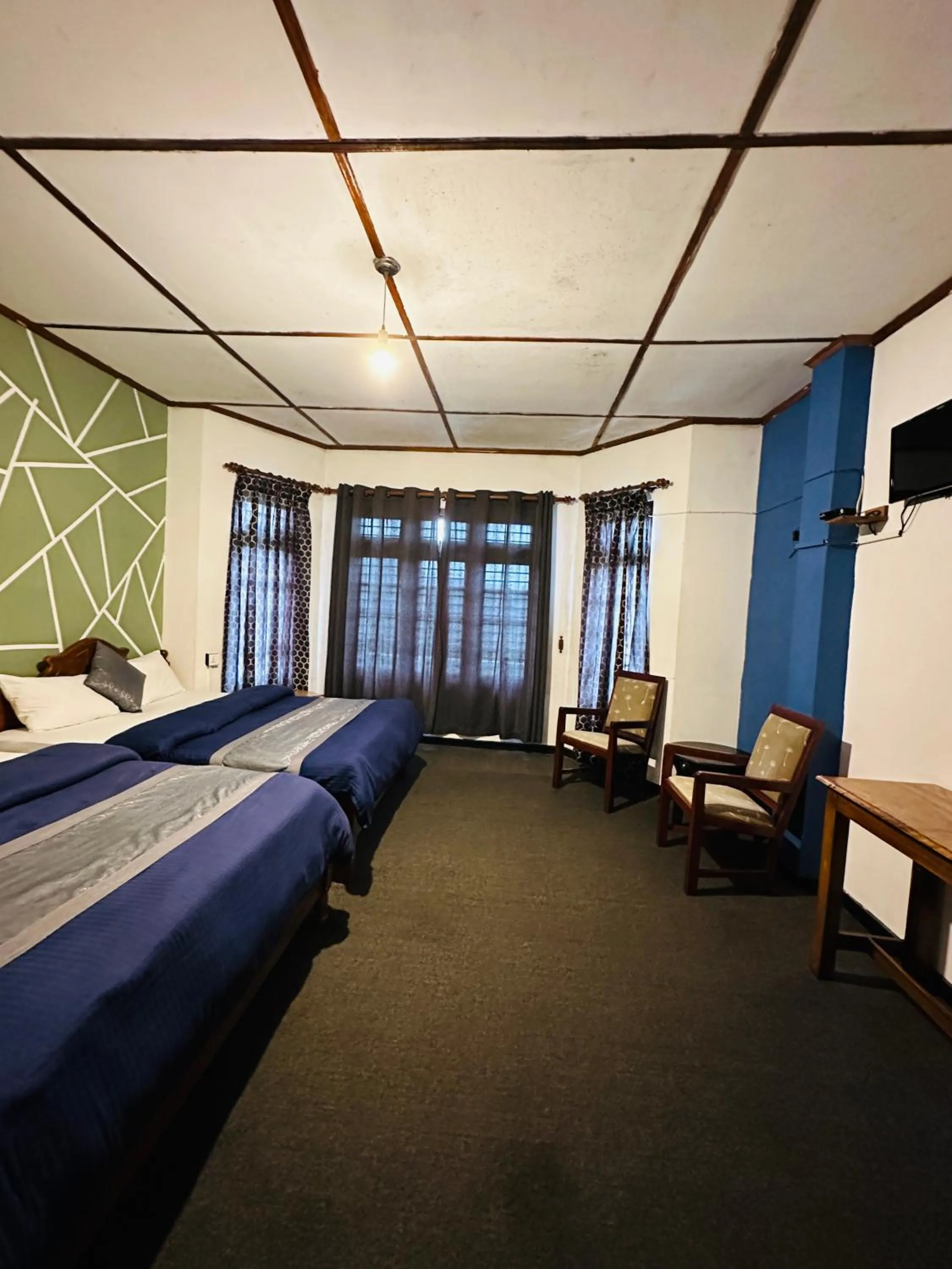 Bed in New Royal Mount Hotel