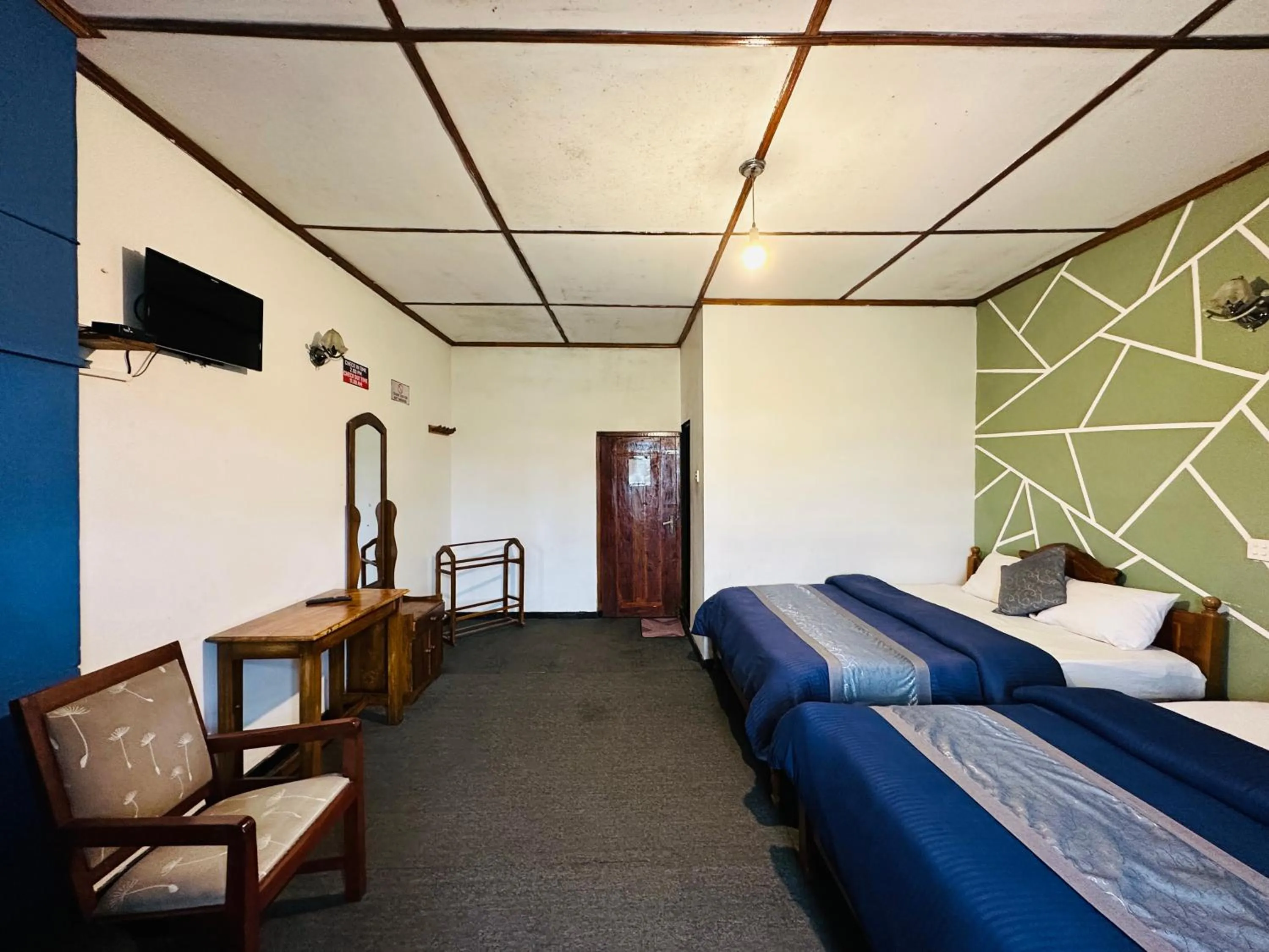 Bed in New Royal Mount Hotel