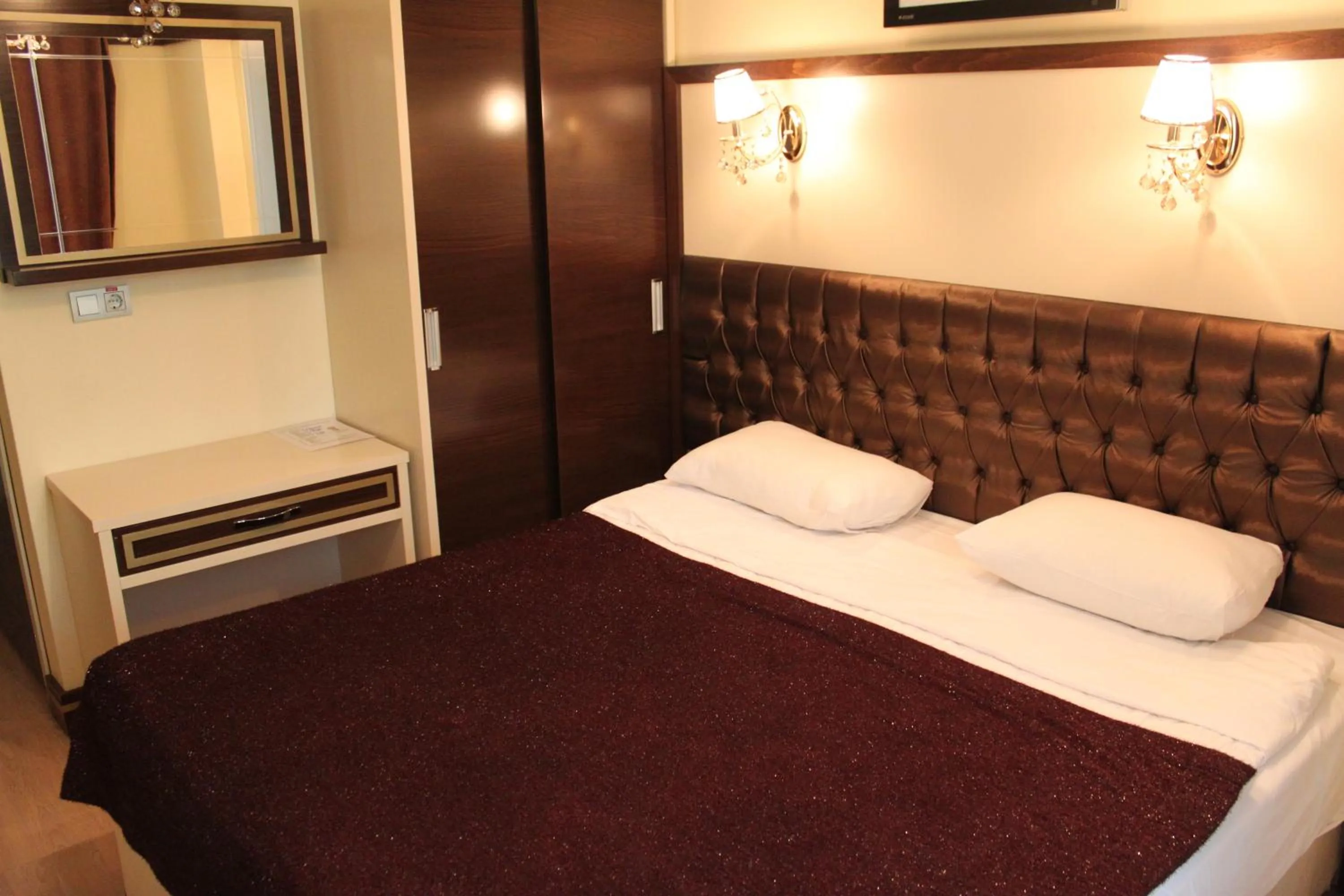 Bed in Gloria Tibi Hotel