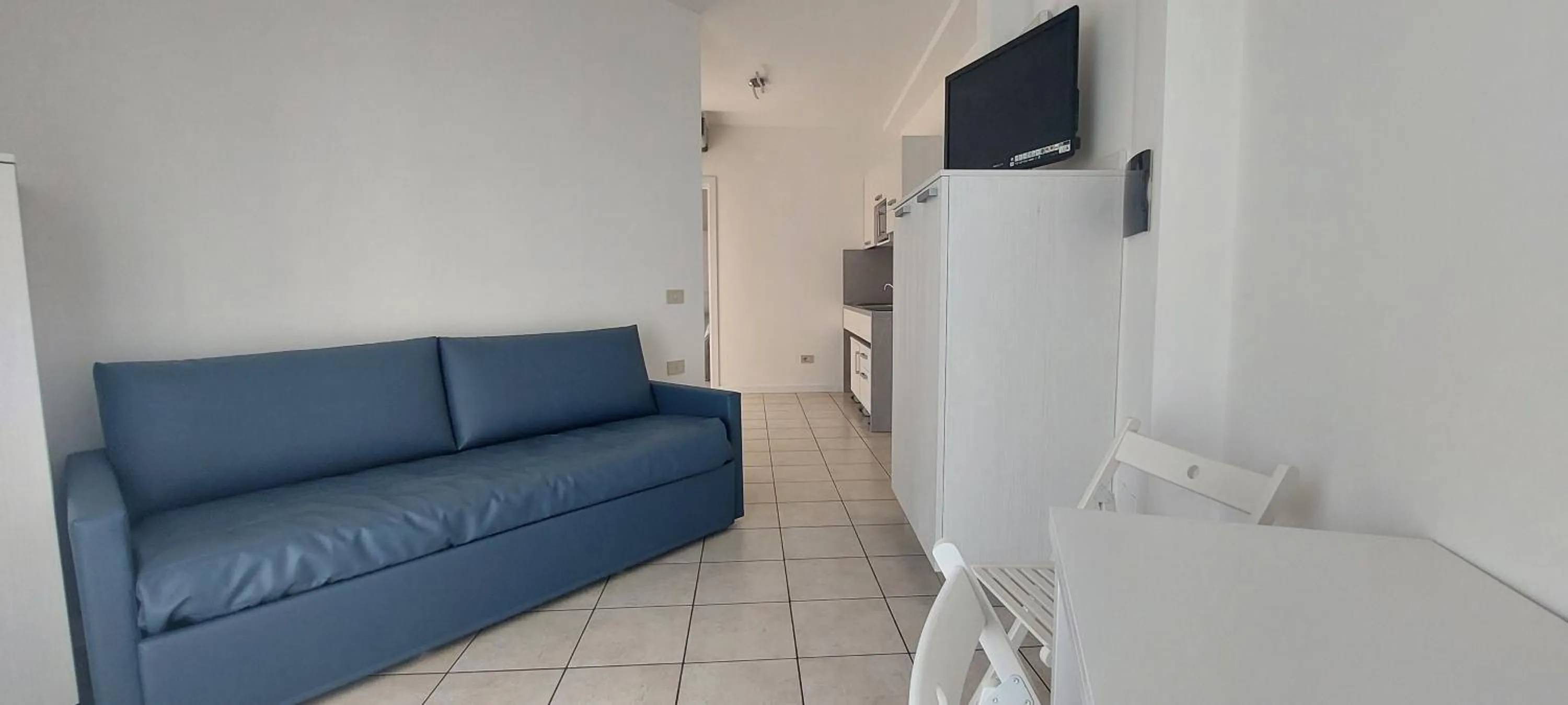 Communal lounge/ TV room in Hotel Residence Mara