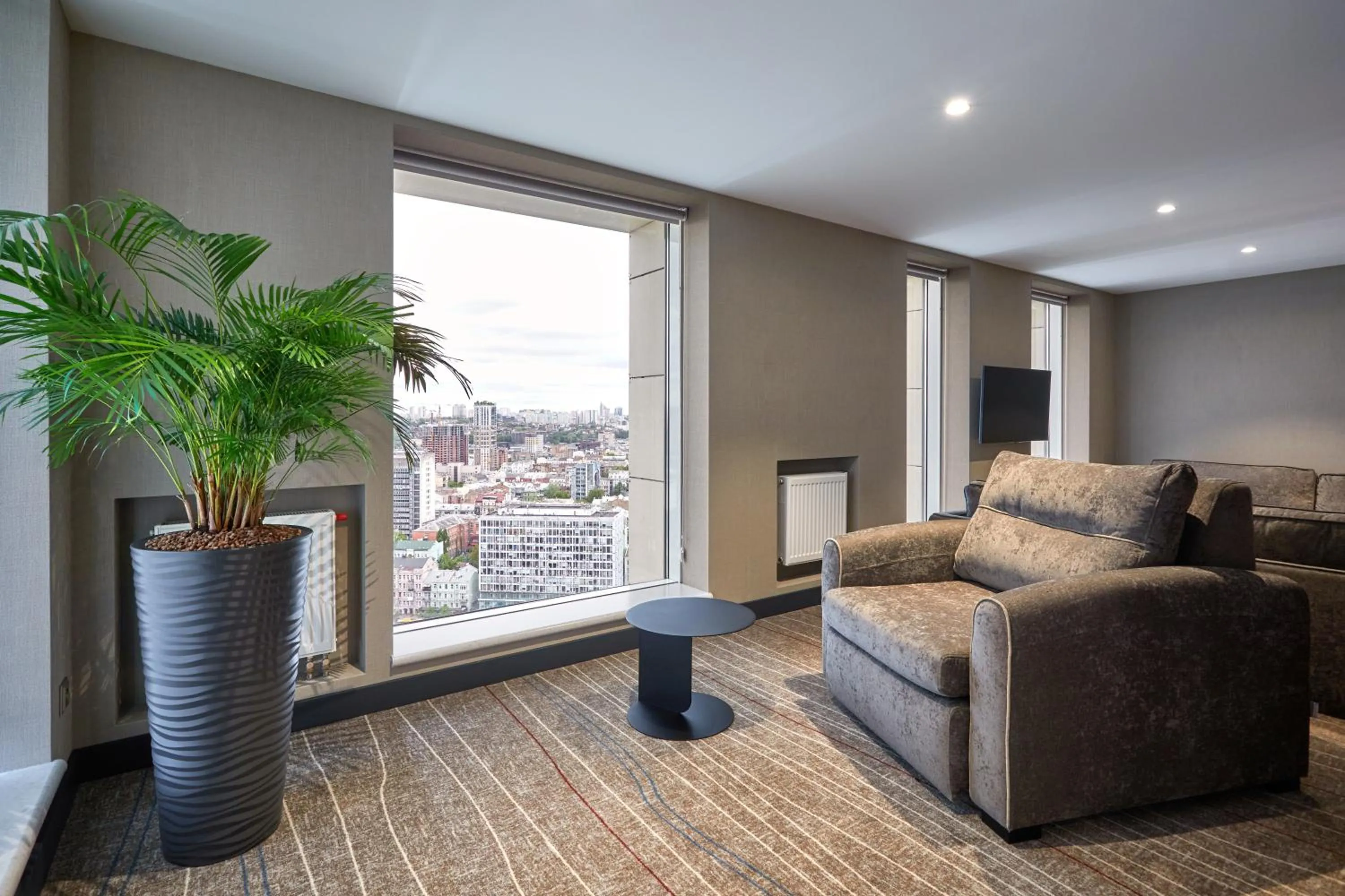 Living room in Sky Loft Hotel Kyiv by Rixwell International