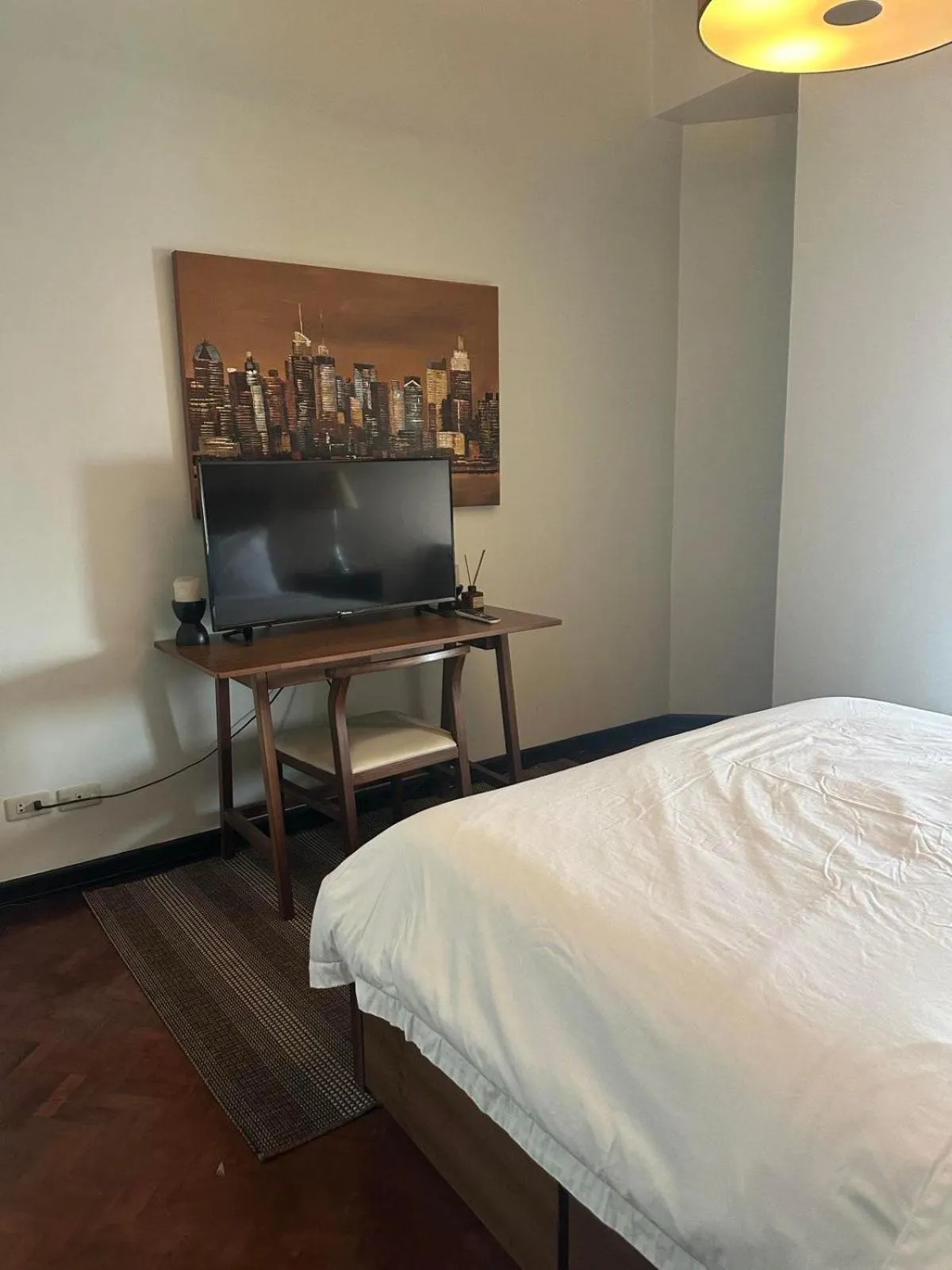 Bed in Suites de Marina Manila with Netflix