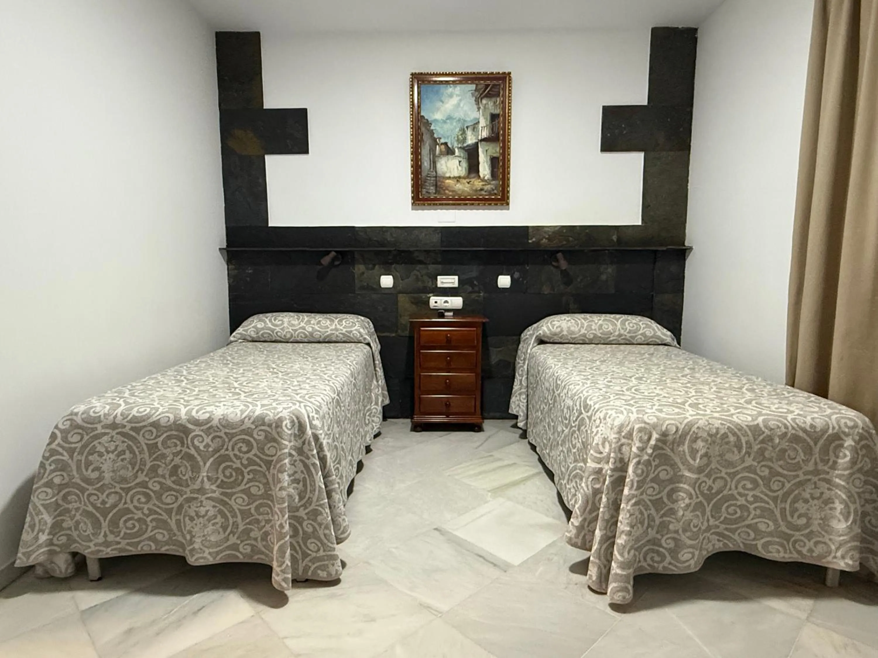 Bed in Hotel Quitagolpe