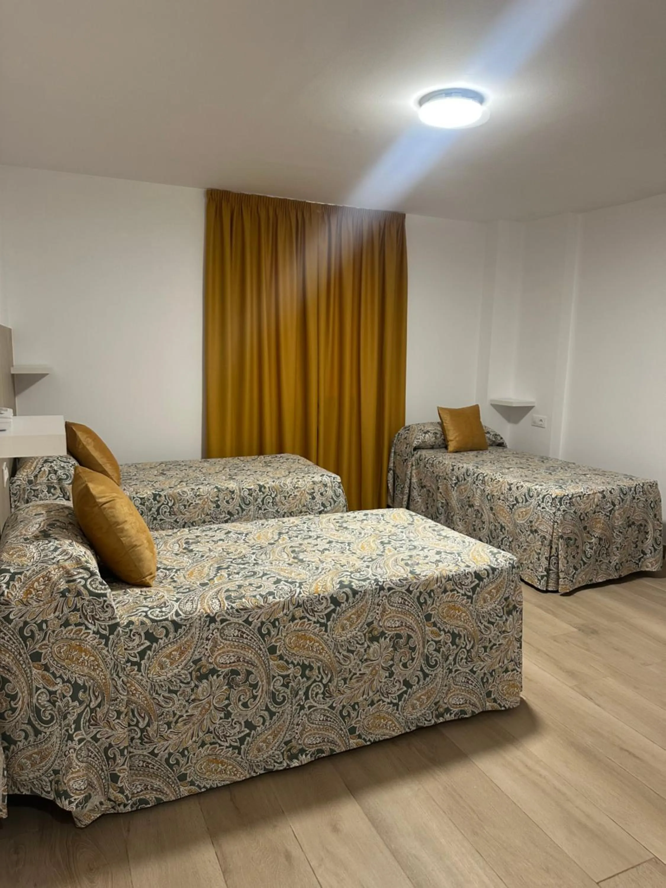 Bed in Hotel Quitagolpe