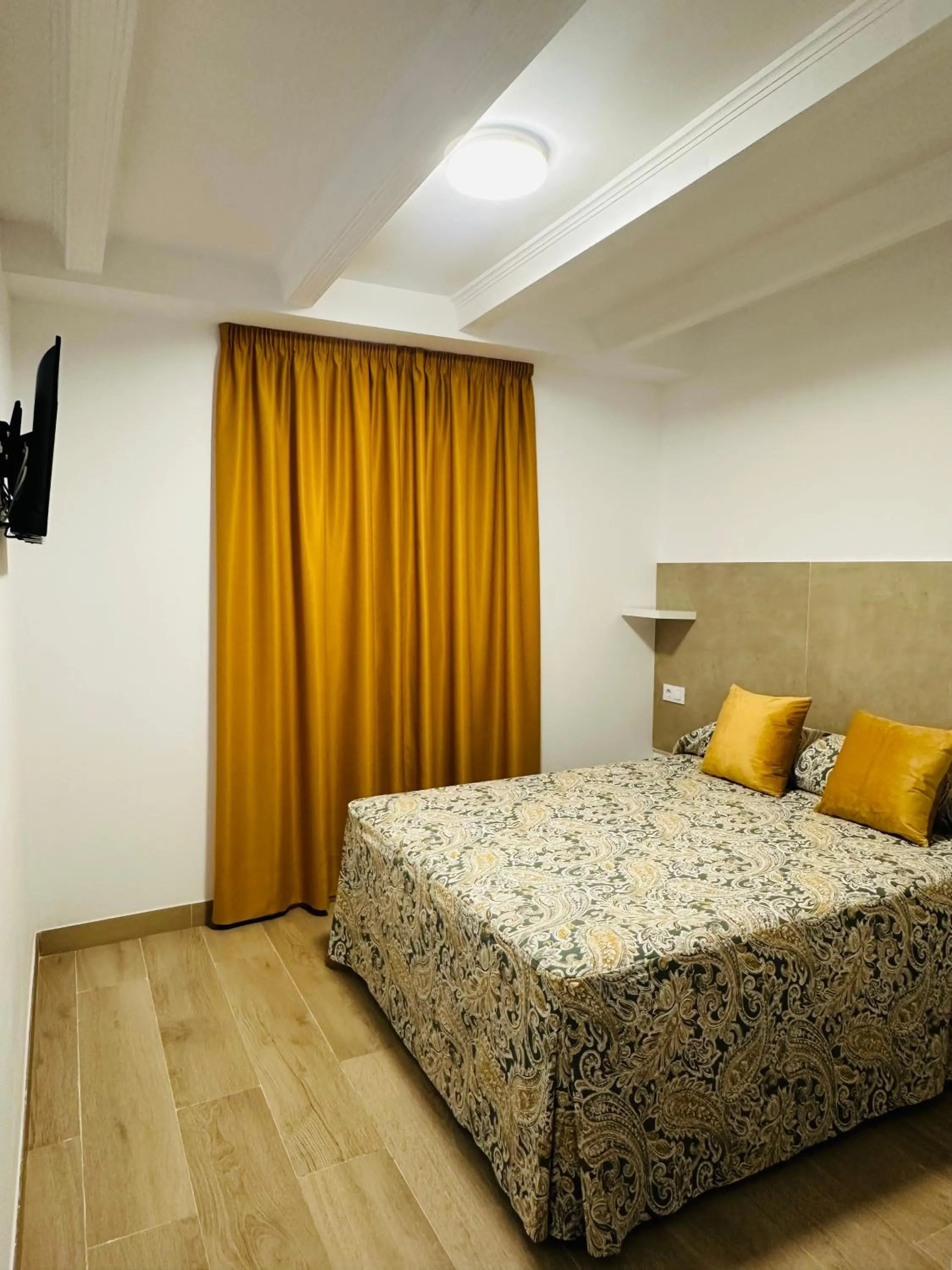 Bed in Hotel Quitagolpe