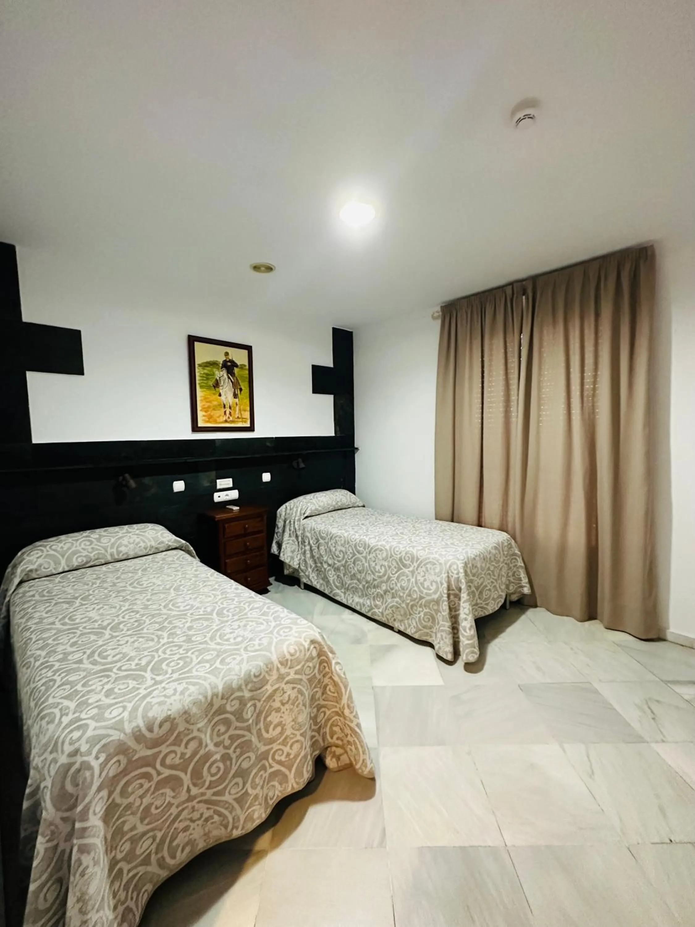 Bed in Hotel Quitagolpe