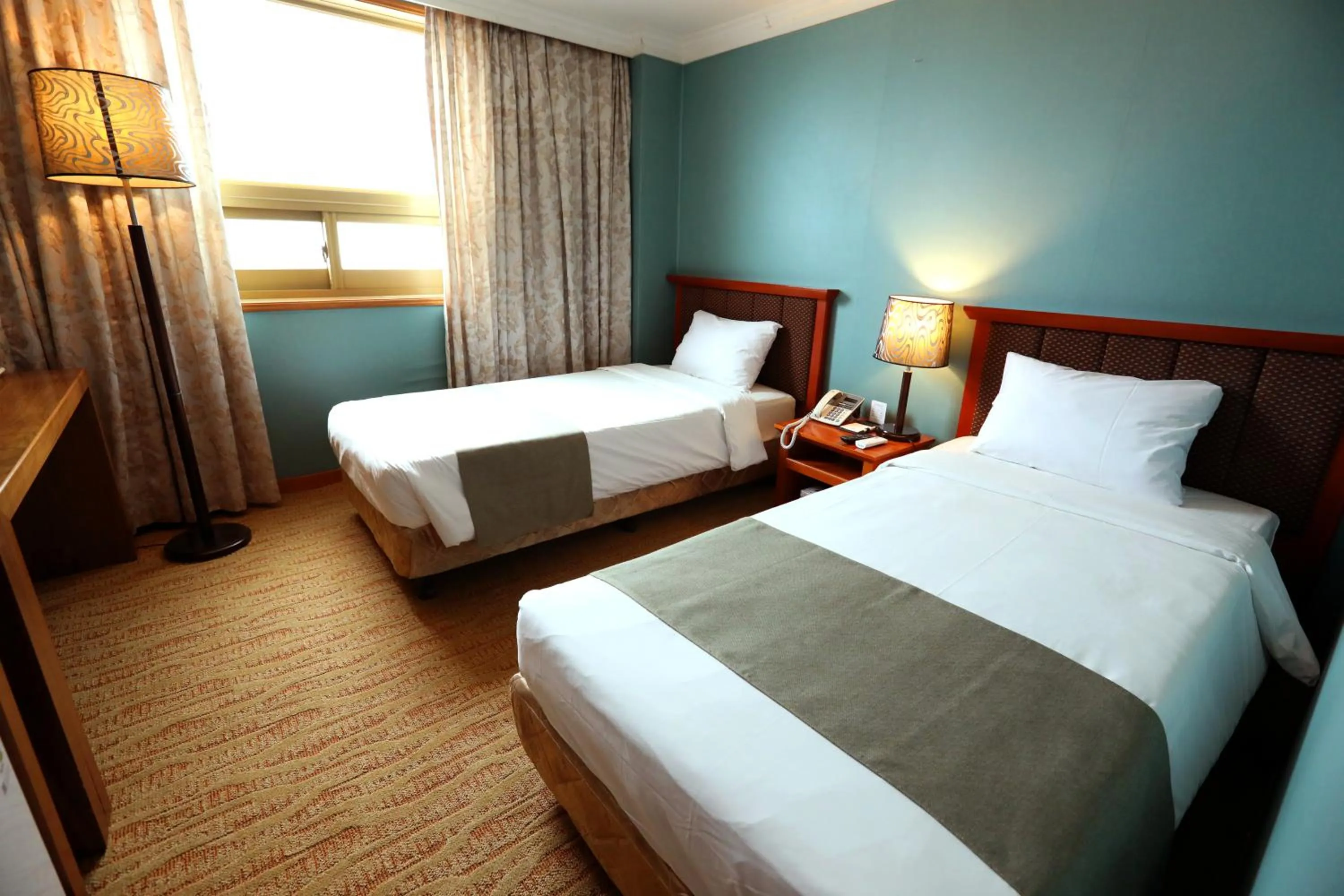 Bed in Prime Tourist Hotel