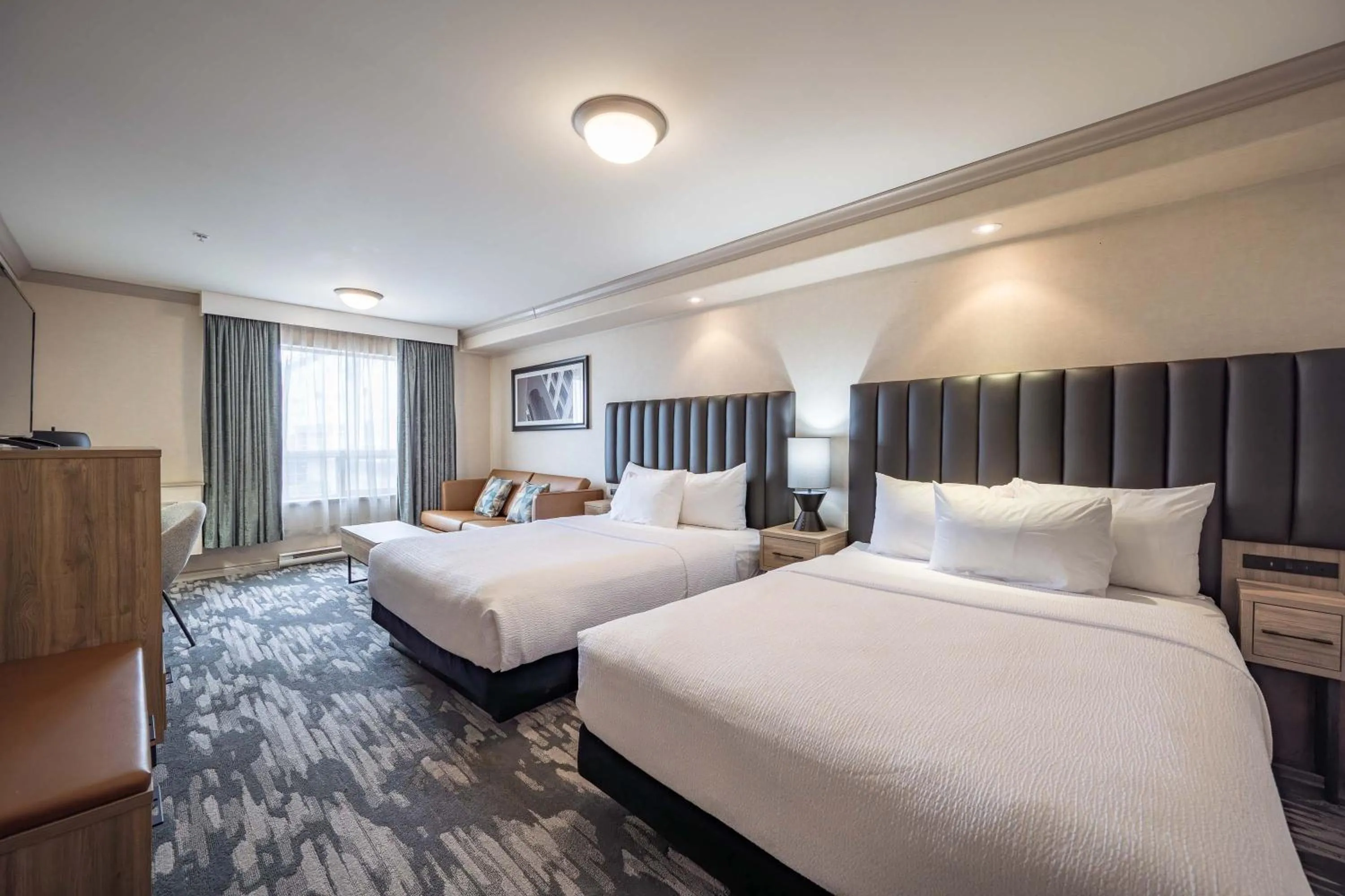 Photo of the whole room, Bed in Sandman Hotel & Suites Winnipeg Airport
