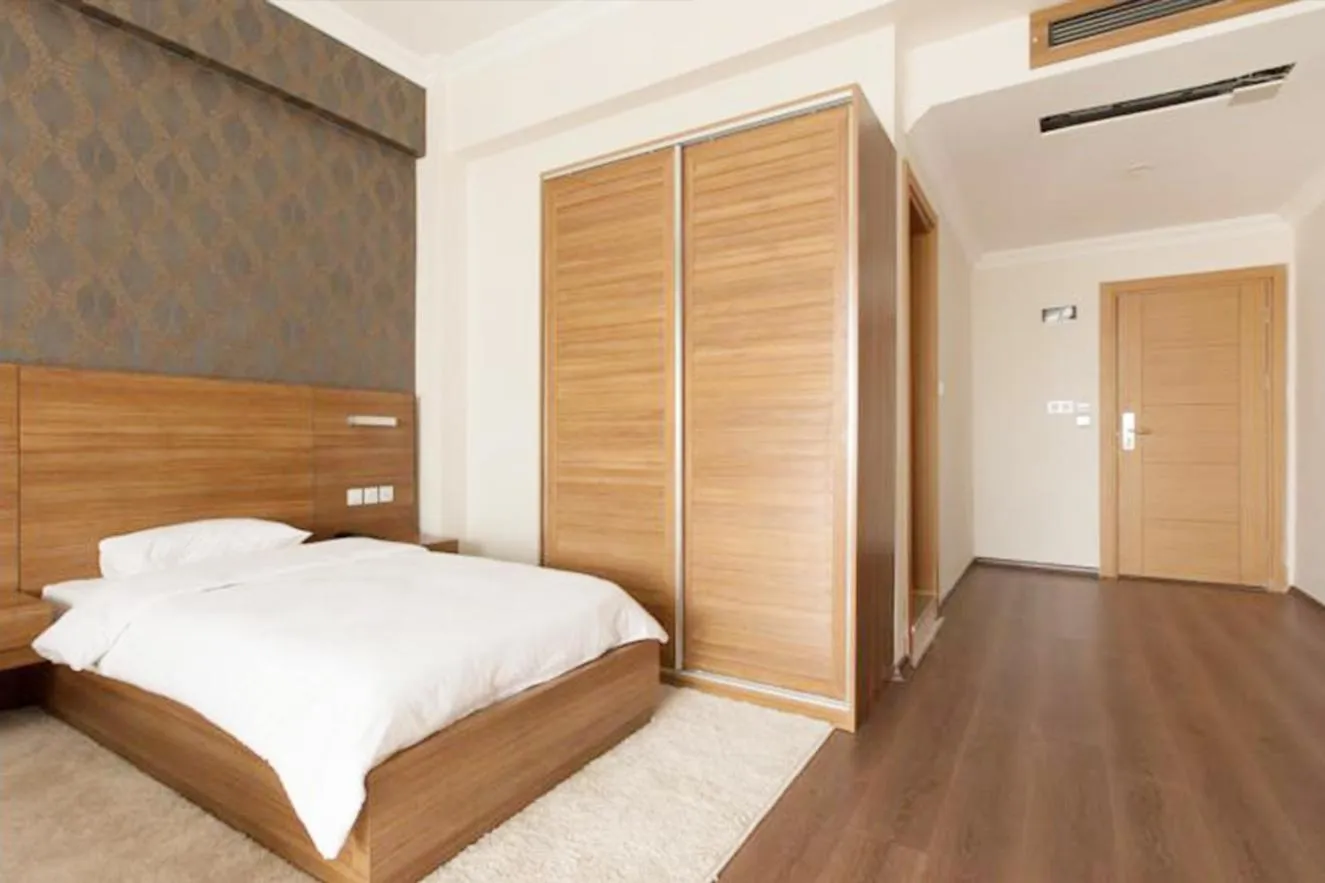 Bed in Carpediem Diamond Hotel